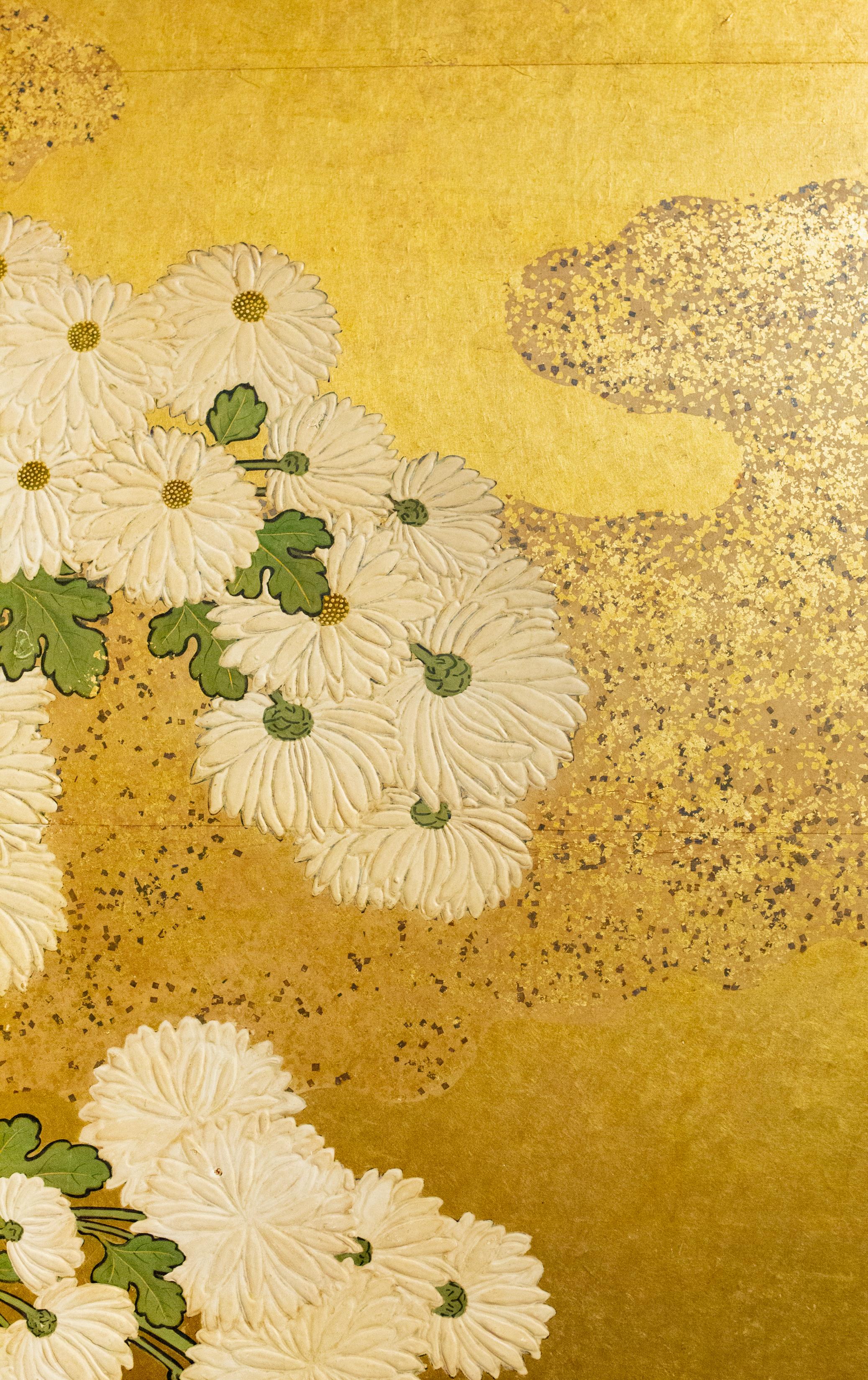 An abundant use of gold with beautifully draped chrysanthemums and gold flake clouds. Mineral pigments, go fun, gold leaf on mulberry paper with a silk brocade border.