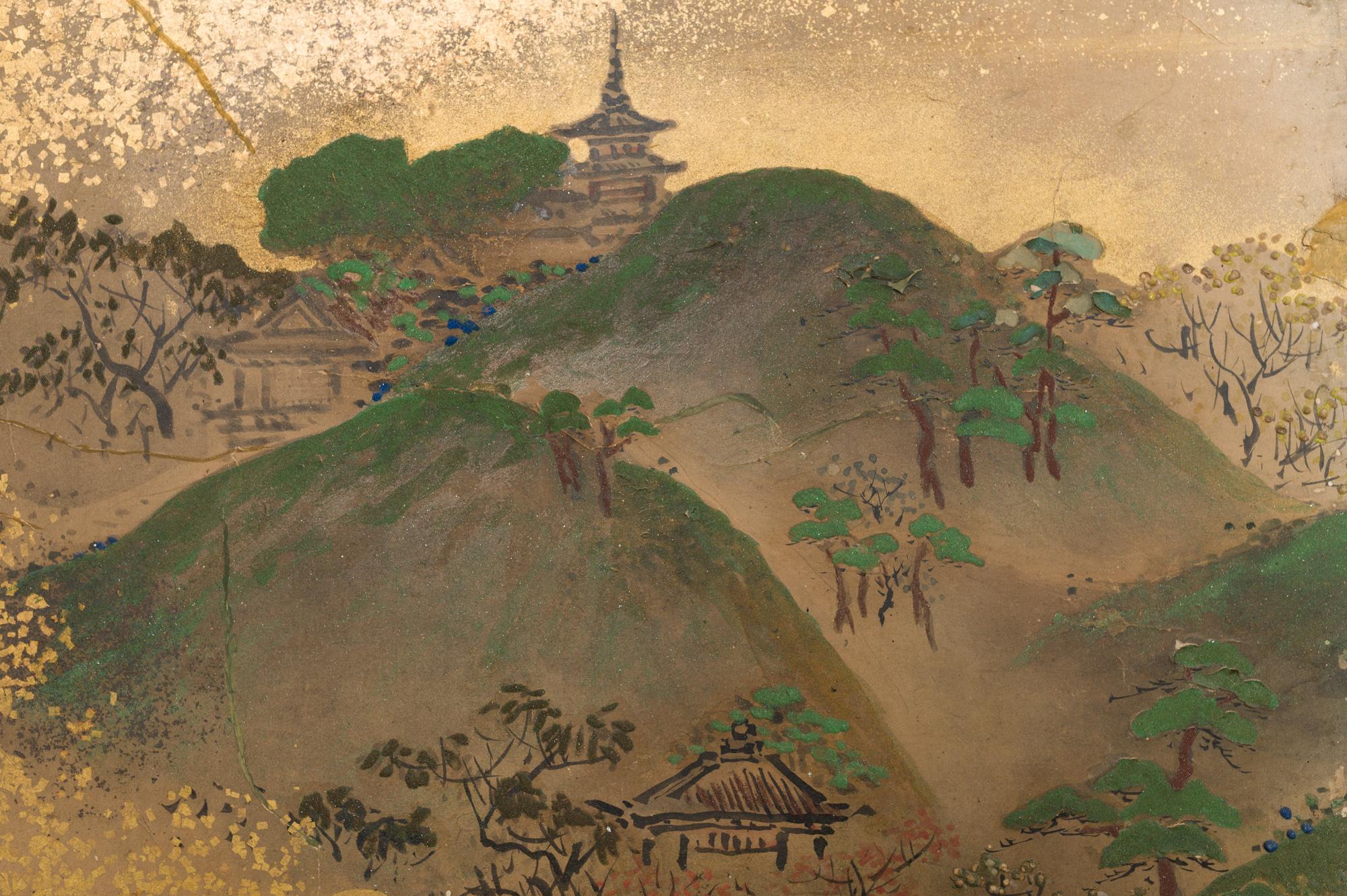 A mid-sized six panel screen. Edo period (c. 1800) painting of a landscape features a temple on the mountain top, a river with fishermen emerging from golden mist, and depicts farmers crossing a bridge between tree covered hills and mountains.