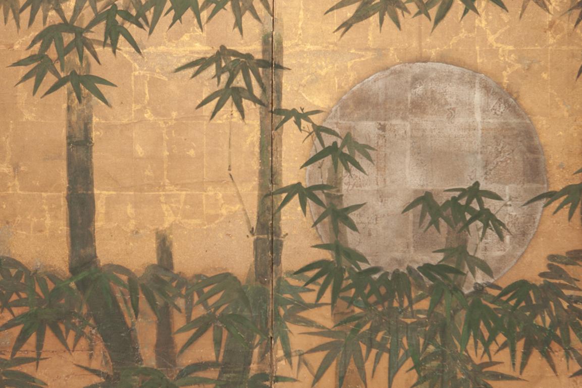 Japanese six-panel screen, silver moon and bamboo on gold, a silver leaf moon seen through a bamboo forest and low hanging gold leaf clouds. Mineral pigments painted on heavy gold leaf and mulberry paper. A small six-panel screen with a tranquil