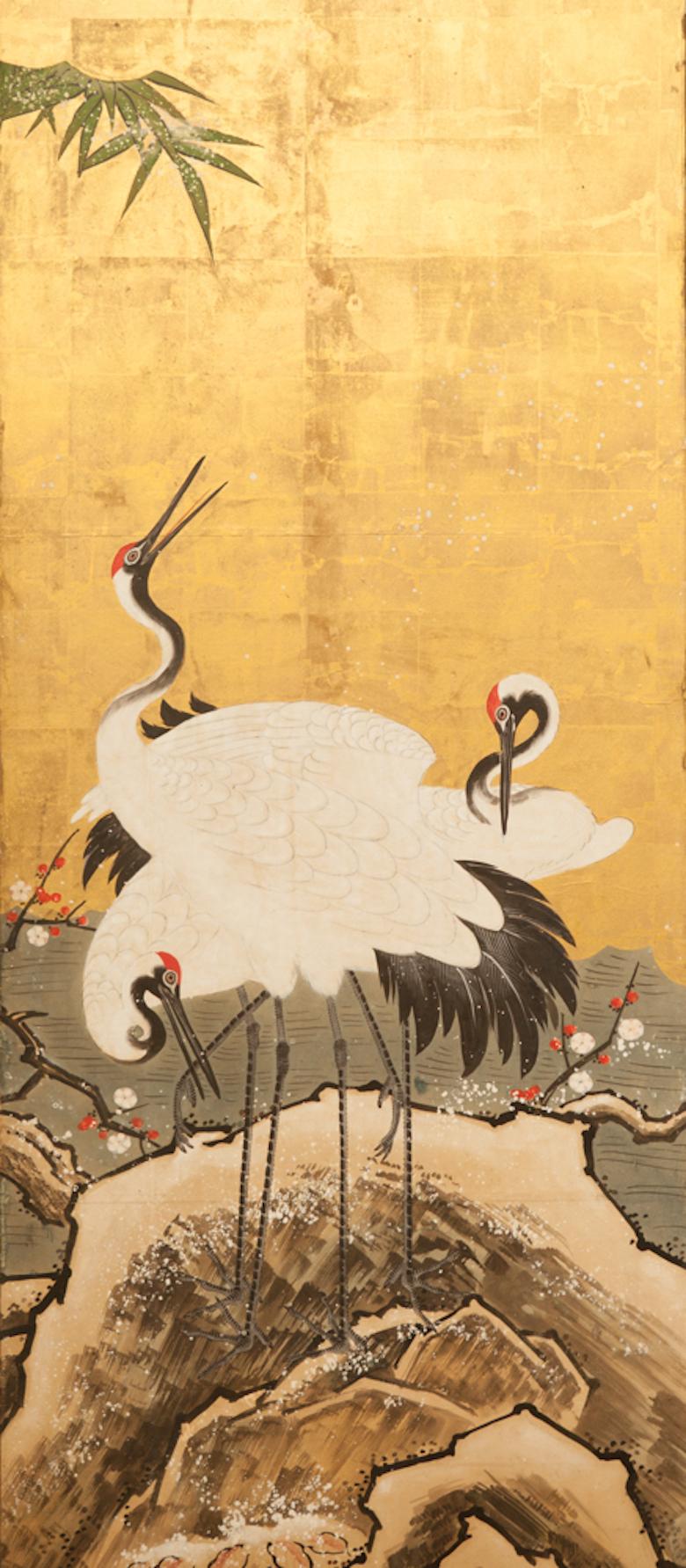 Japanese Six Panel Screen: Snow Scene at Water's Edge with Flowers and Waterfowl.  Edo period painting (mid 19th century) of plum, bamboo, white camellias, cranes and mandarin ducks in a snowy scape with gold leaf clouds.  Kano School painting in