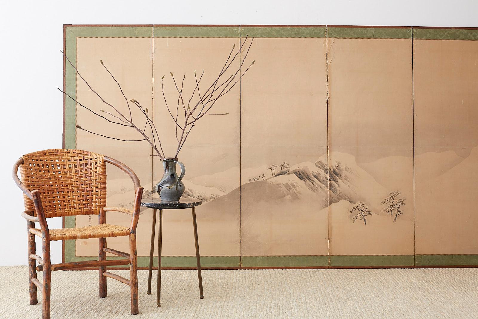 Monumental Japanese six-panel Meiji period screen depicting a serene snowscape mountain scene. Ink on paper made in the Maruyama school style late 19th-early 20th century. Bearing an inscribed date: Tenmei 1st year (1781) autumn. Signature reads
