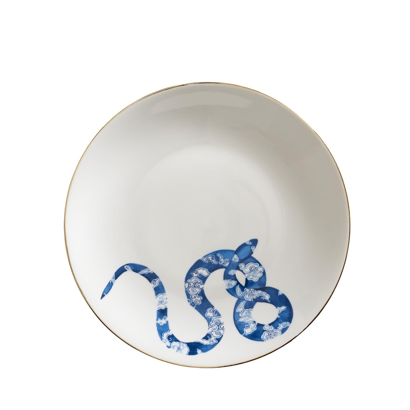 Part of a collection depicting various colorful snakes to ornate each precious piece, this set is made of one dinner plate, one soup plate, and one dessert plate, all entirely made in Italy using fine Limoges porcelain with a polished gold trim