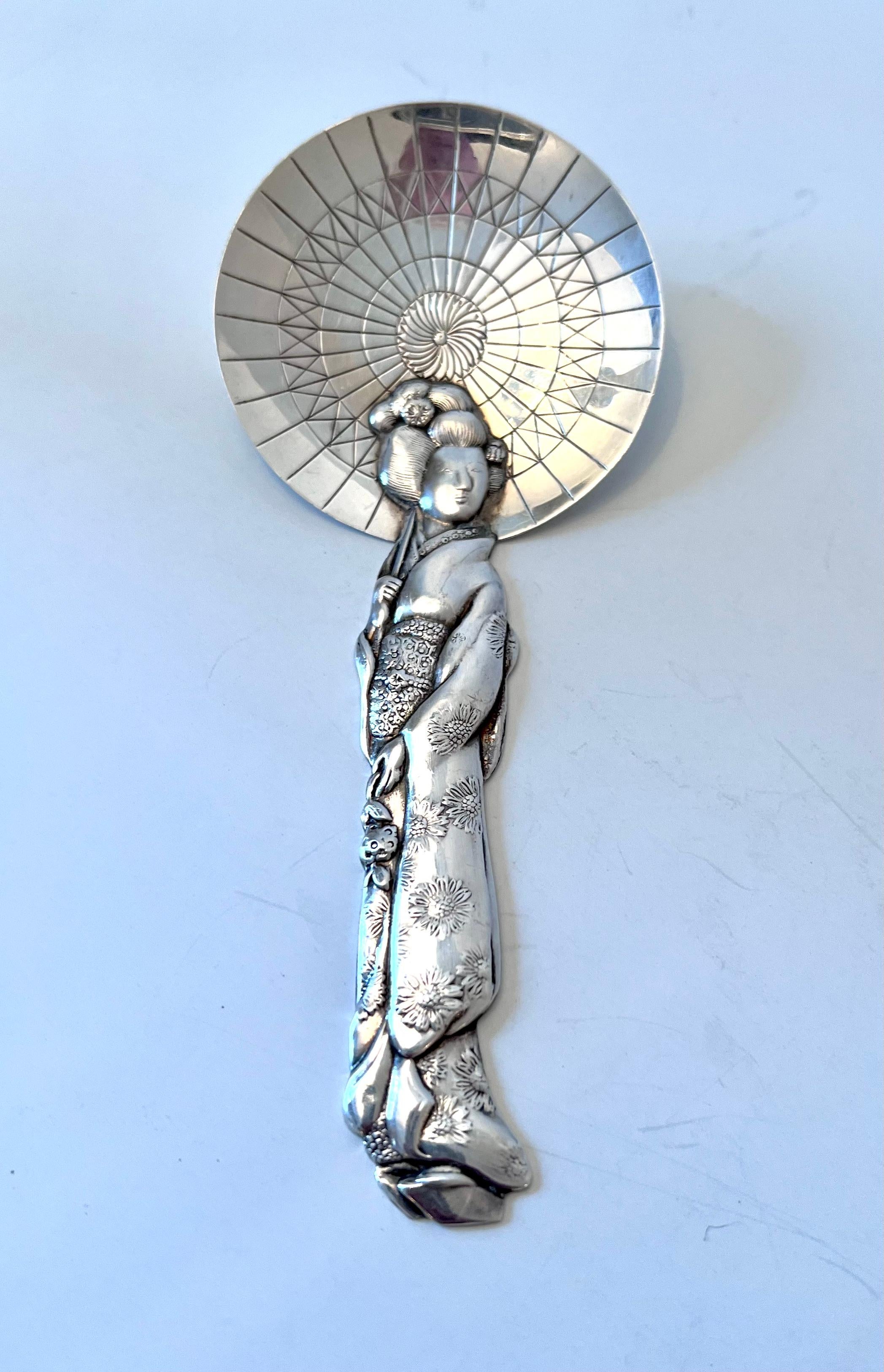 A unique sterling silver geisha tea caddy spoon. Makes a great spoon for many items or as a decorative piece. Beautifully hand crafted piece with great details.