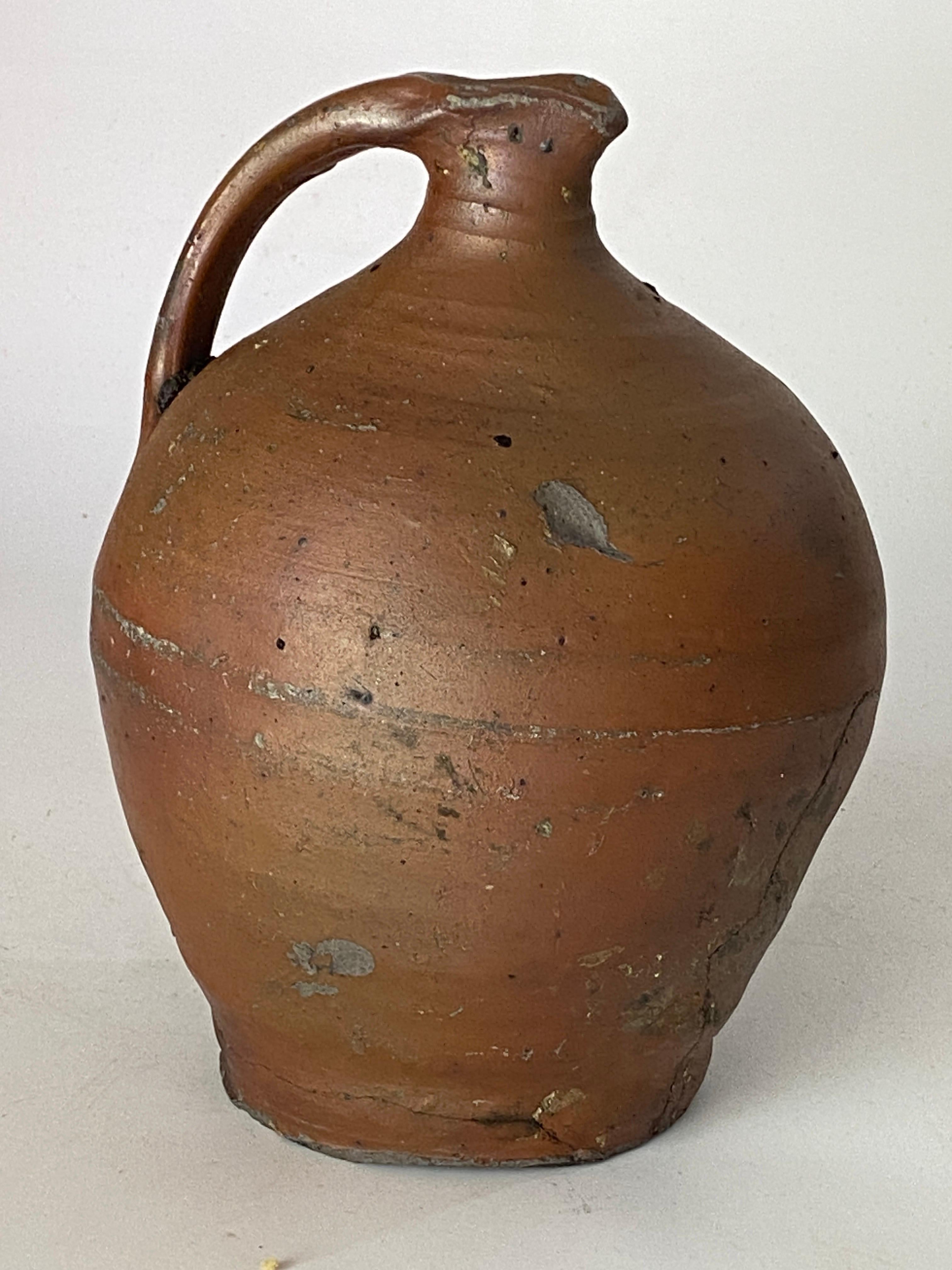 Jug or pitcher in Stoneware, with an exceptional patina. It's color with brown gives very pleasant contrasts. This Pitcher was created in Japan, circa 19th century.