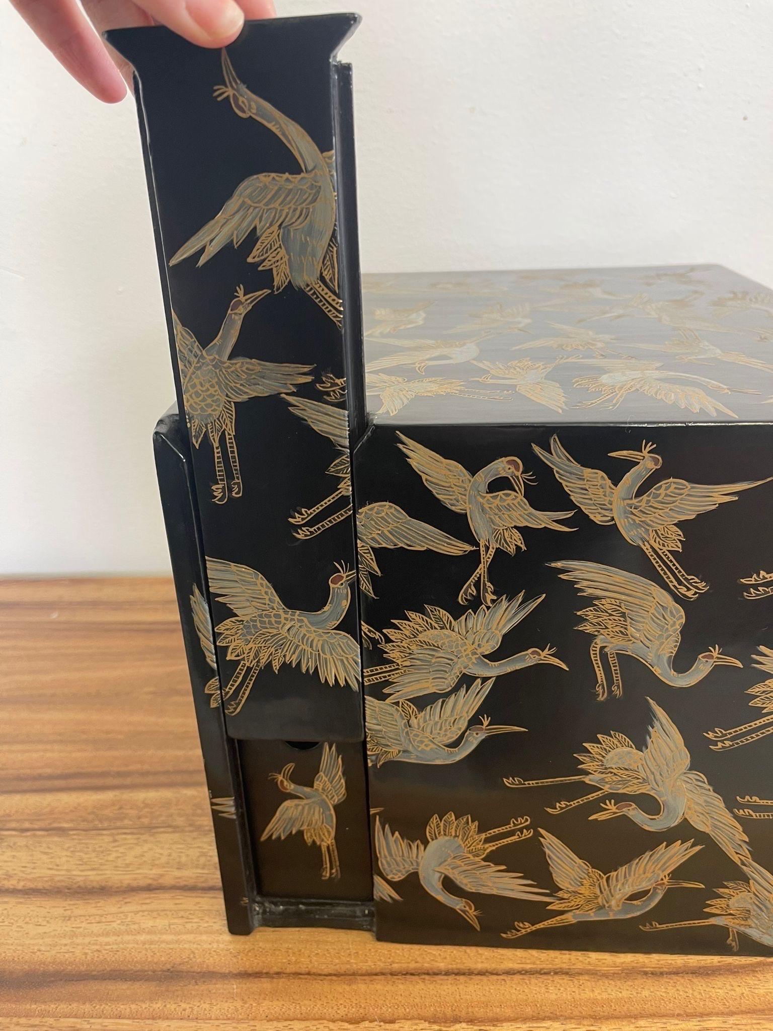 Late 20th Century Japanese Storage Box With Hidden Compartments and Crane Motif.