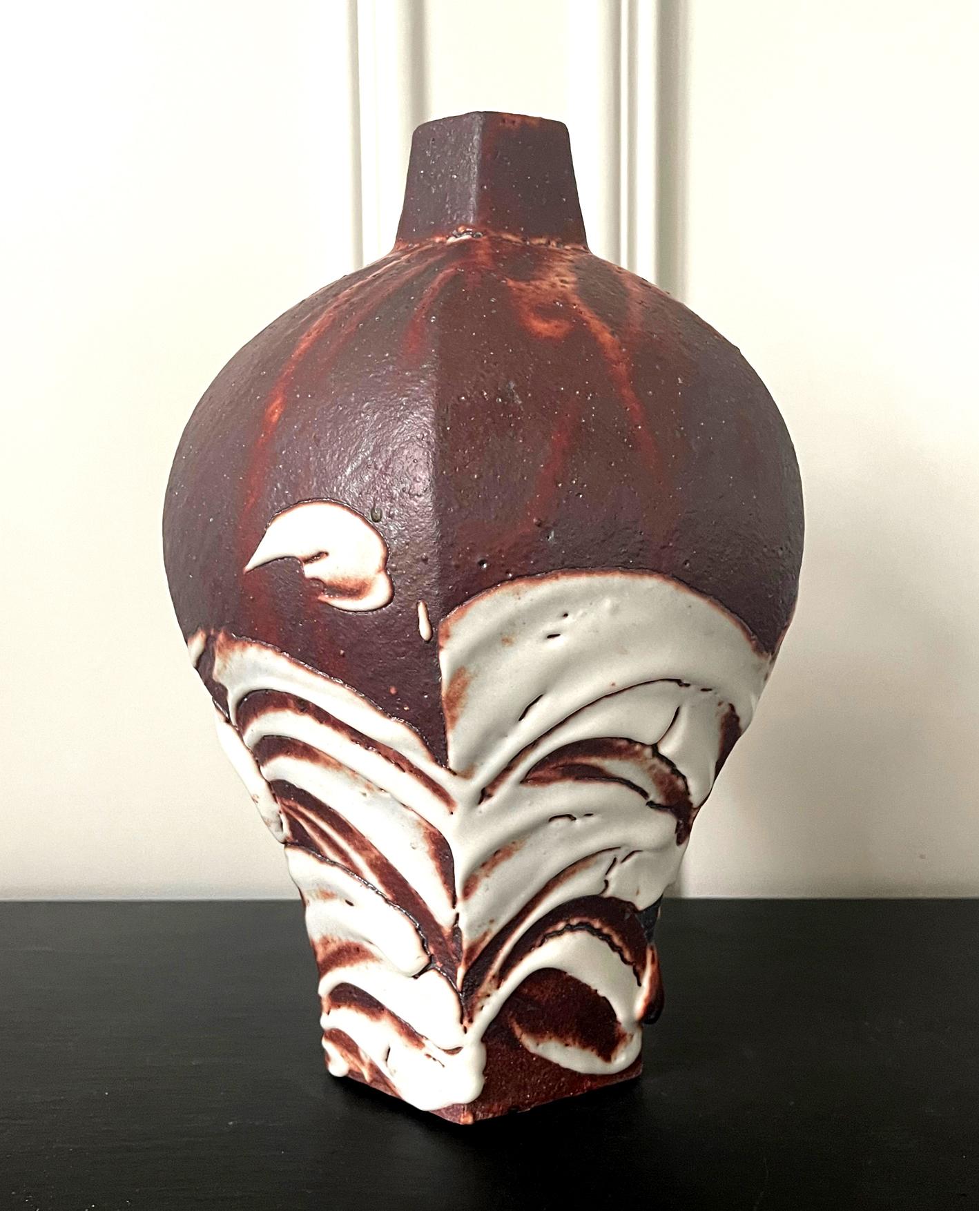 An impressive stoneware bottle form vase by contemporary Japanese studio potter Ken Matsuzaki (1950-) circa 2010s. The solid form takes its cue from Chinese traditional plum vase (Meiping) with raised and swelled shoulder and a small opening, yet it