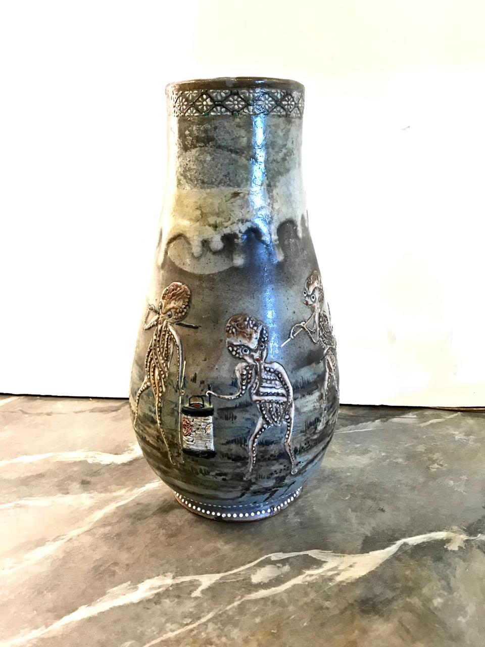 This is a stunning 20th century Japanese Studio Pottery vase. The rendering of the pottery shows direct influences of the Satsuma potting tradition; the anthropomorphized octopus figures are highly unusual and beautifully depicted. Although
