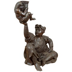 Japanese Style Bronze Sculpture of a Seated Woman Holding a Mythical Creature