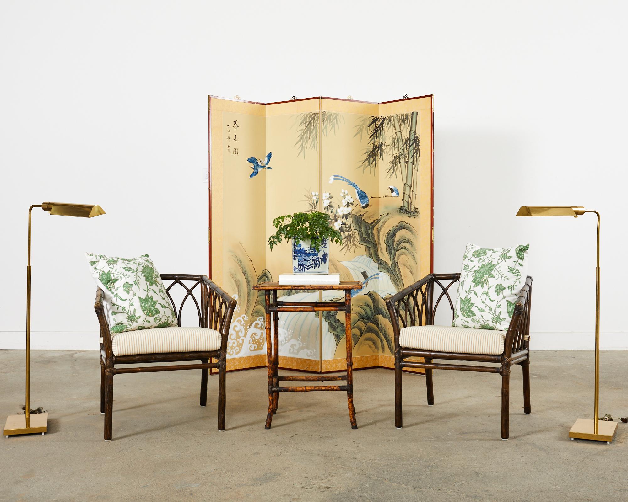 Large Chinese four panel Japanese style byobu folding screen depicting a waterfall landscape. The scene is decorated with bamboo, colorful blue magpies, and crashing waves. Constructed with ink and natural colored pigments on paper and set in a wood