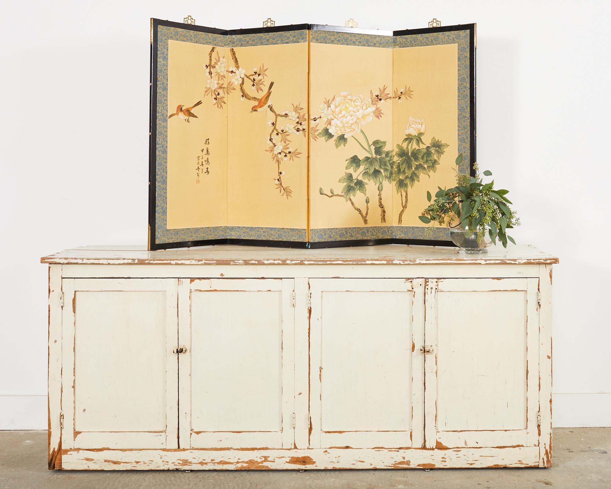 Attractive Japanese style folding four panel byobu screen from the late Showa period. The screen is titled friendly birds singing in spring and signed by an artist with a cyclical date of Jiazi or spring 1984. The scene depicts two birds in spring