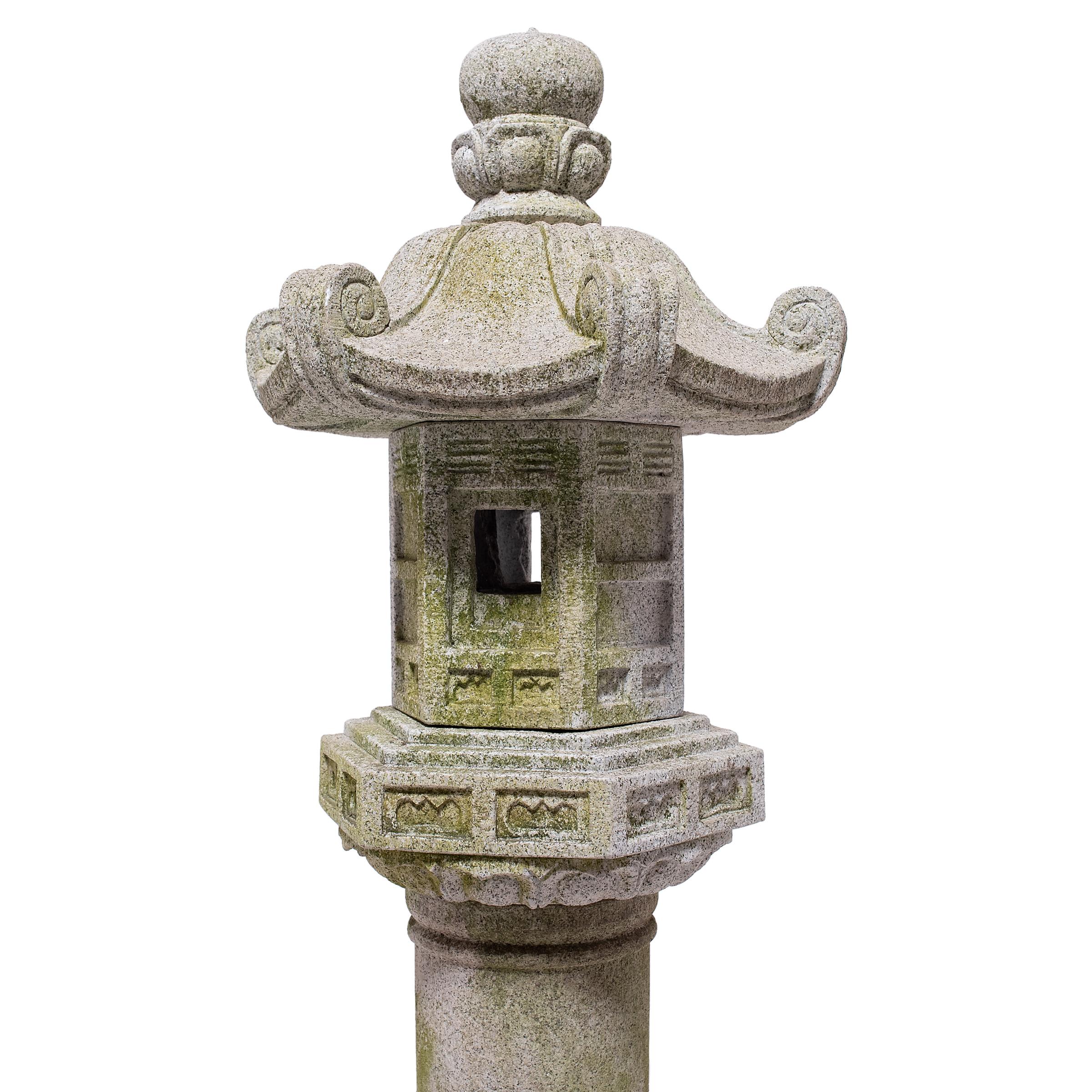 This Japanese stone lantern (ishi-doro) is a lovely example of a pedestal lantern (tachi-doro), used in the traditional Japanese garden to contrast lush foliage and cast light on its surroundings. The specific design of this lantern recreates the
