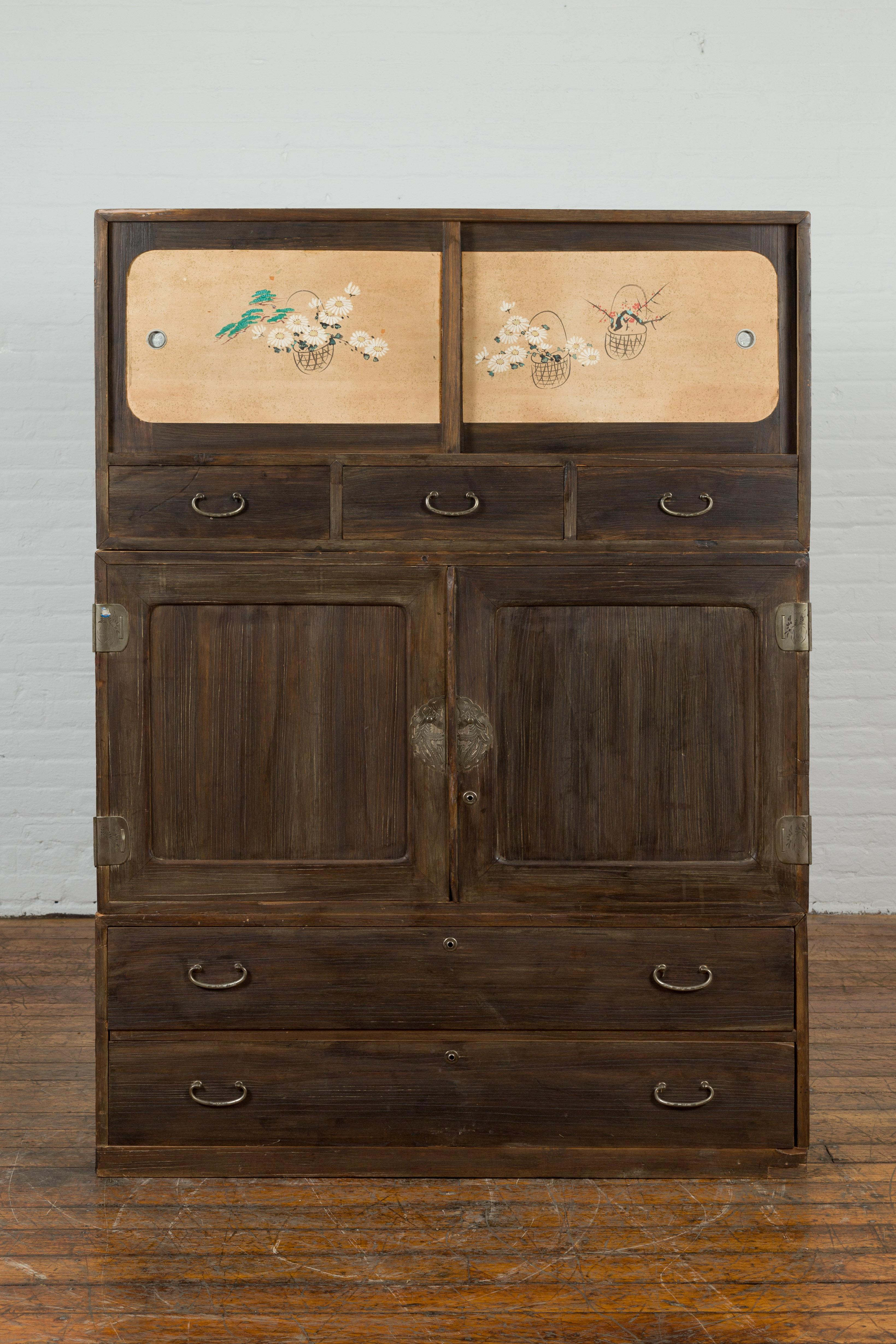 This stunning Japanese Taisho vintage cabinet is a favorite addition to our antique and vintage cabinets collection. Crafted during the early 20th century, this large vintage cabinet is made of wood that comes from the Kiri tree - also called the