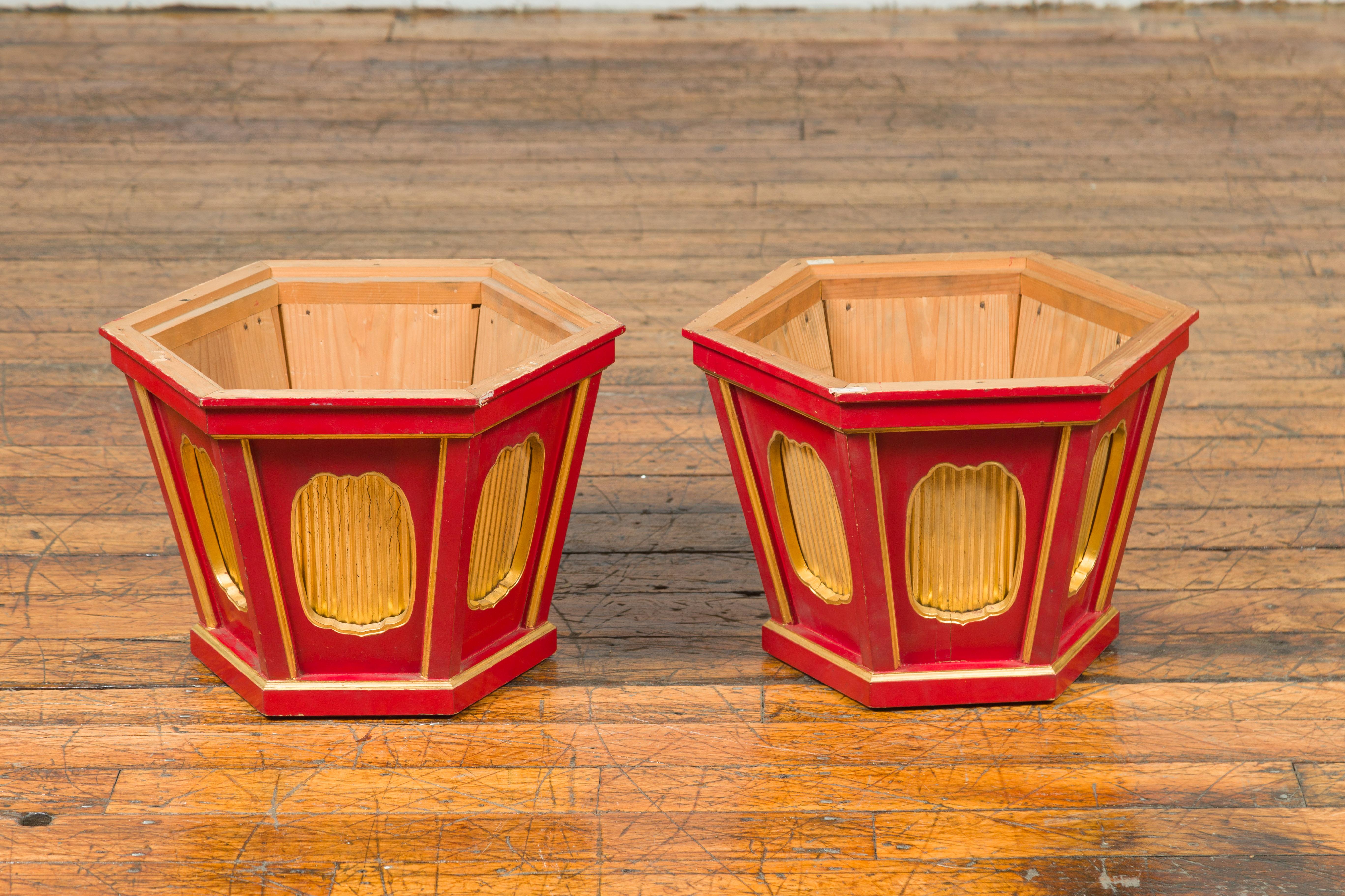 A pair of Japanese Taisho period gold and red lacquer hexagonal planters from the early 20th century, with recessed reeded cartouches. Hailing from the Taisho period in Japan (1912-1926), this captivating pair of hexagonal planters is a testament to