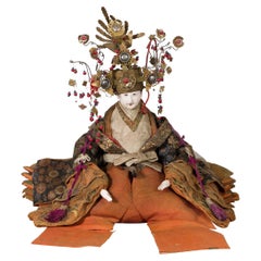 Japanese Taisho Period Sitting Doll with Silk Clothing and Ornate Headdress
