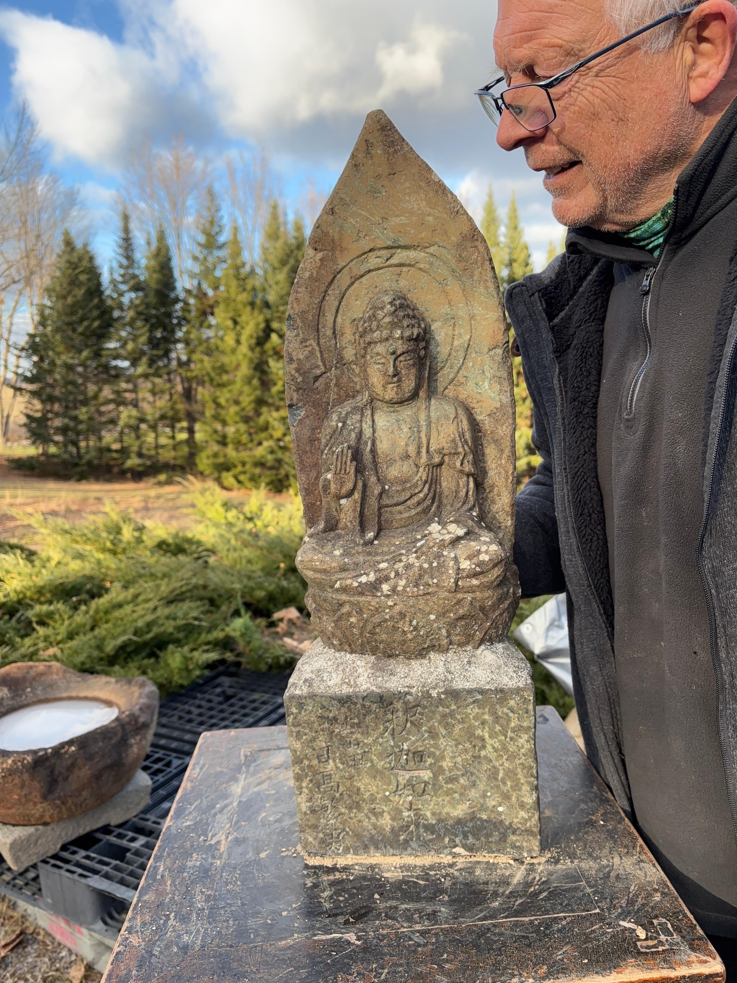 A very old Taisho period early 20th century  granite stone Buddha - Shyaka Nyorai Sakyamuni-  sculpture perched upon a square  base.

Signed front left with named patron: hidaka shigeo 

Good garden candidate

In Japan, Kṣitigarbha, known as