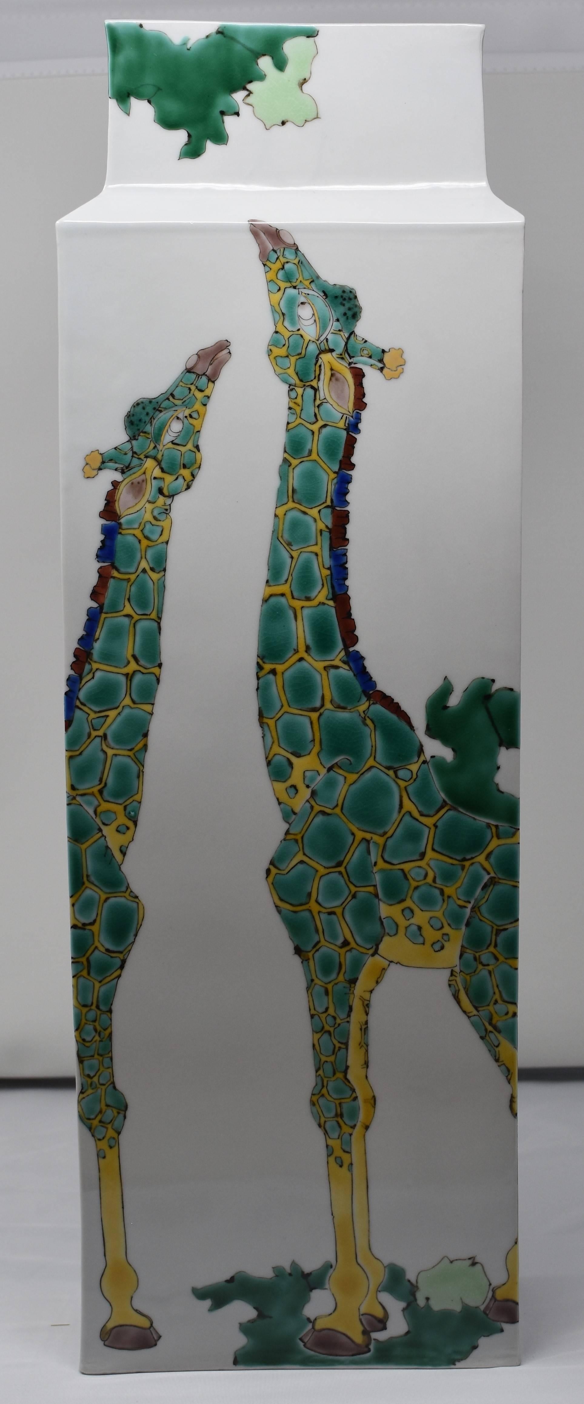 Exquisite contemporary Japanese tall porcelain vase hand-painted in green and yellow on a sgracefully shaped tall rectangular body, with a unique interpretation of giraffes. This is part of a series of pieces featuring the animals of the African