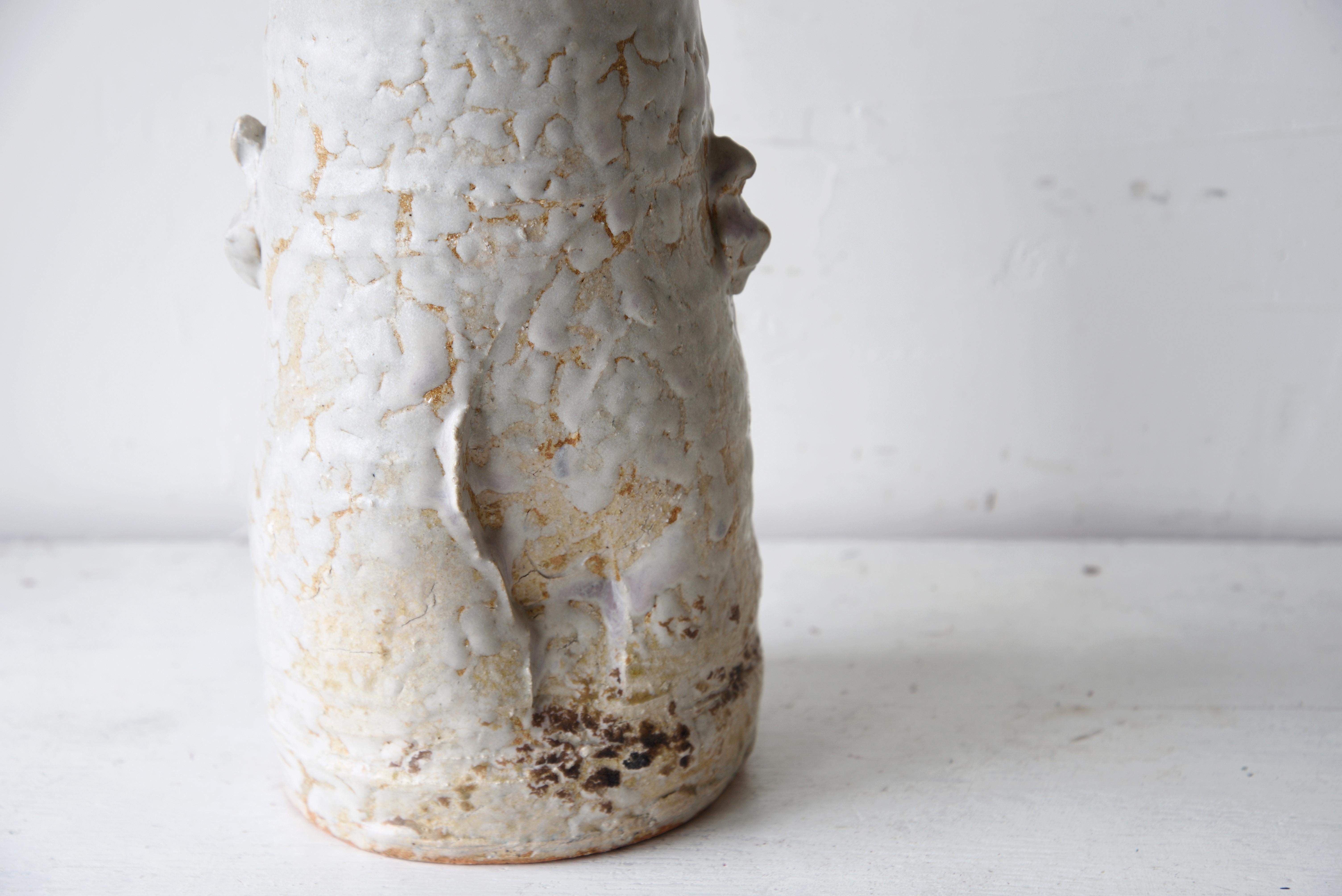 Showa period, 20th century, Japan, approx. H 27.5cm (10.82in), with the seal of ‘Hagi-glazed vase by Jinzo Ishibe’ at lower part and the sign of ‘Jinzo’ at the bottom