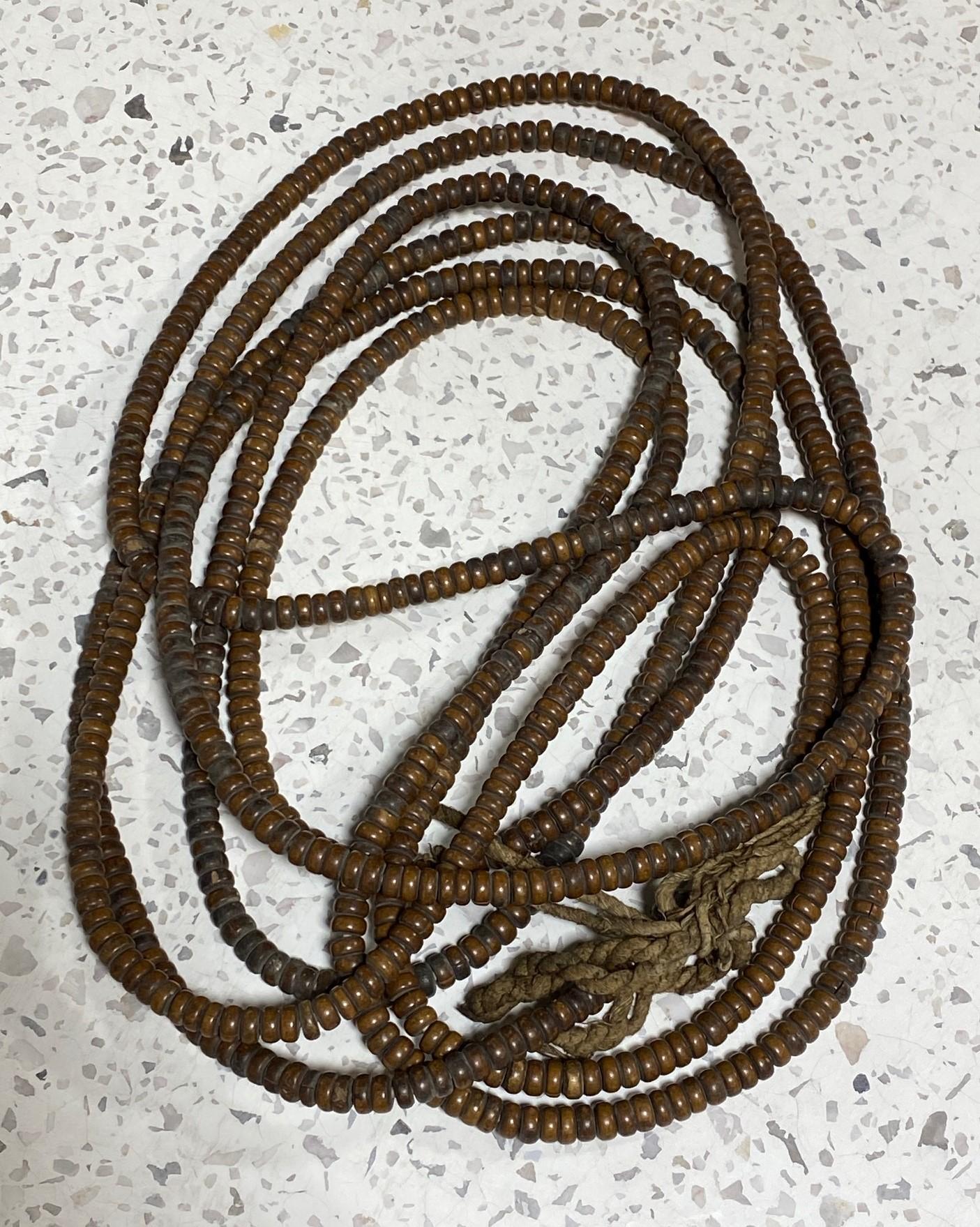 A truly magnificent and special work - this beautiful and exceptionally long string of Japanese hand-crafted natural wood (perhaps Rosewood) Buddhist Juzu mala beads. These rosary-type large prayer bead necklaces were used by Buddhist monks in