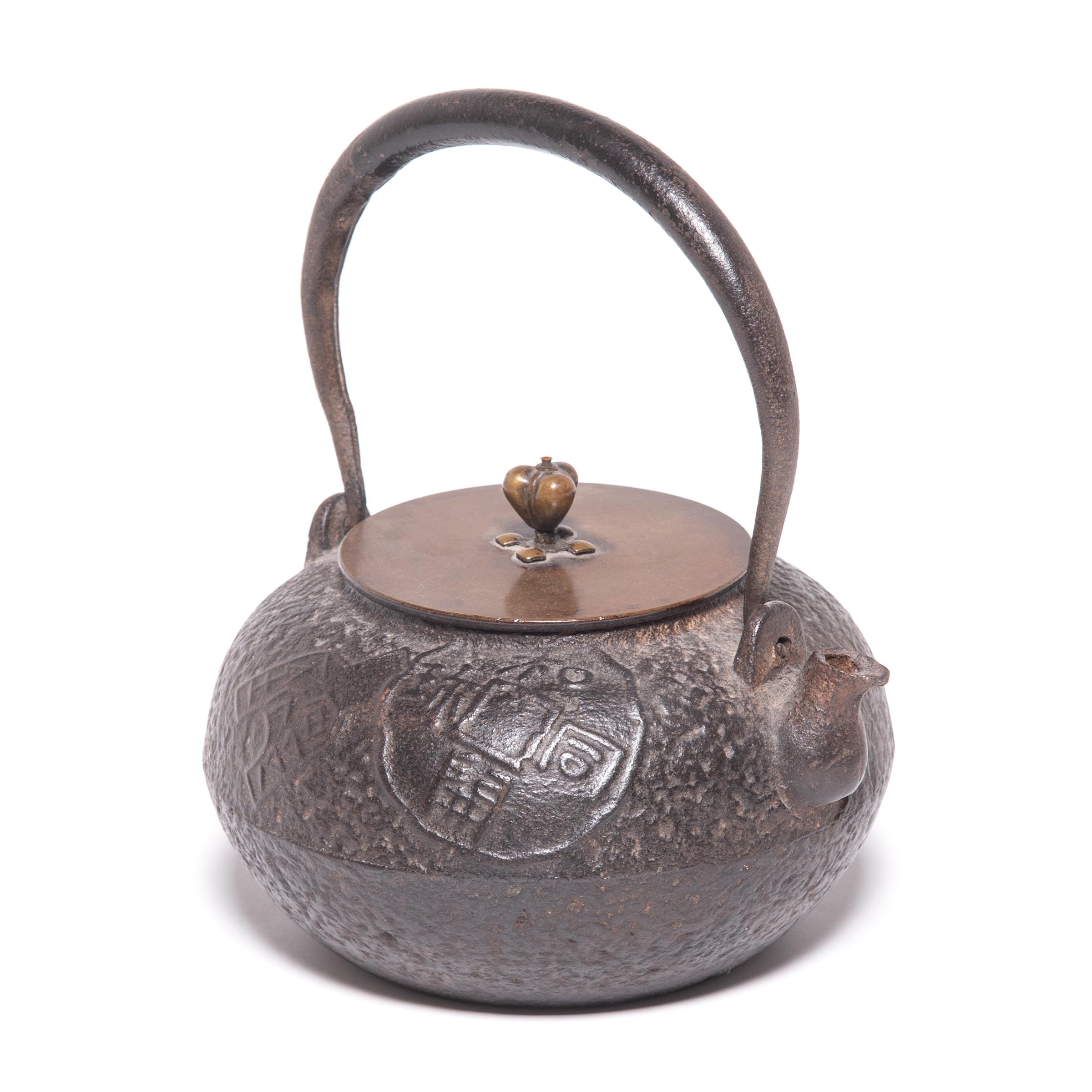 With a short spout and an elegant, arched handle, this Japanese teapot was used to boil water for traditional tea ceremonies. Known as tetsubin, the kettle’s cast-iron construction is said to change the quality of the water, making tea taste mellow