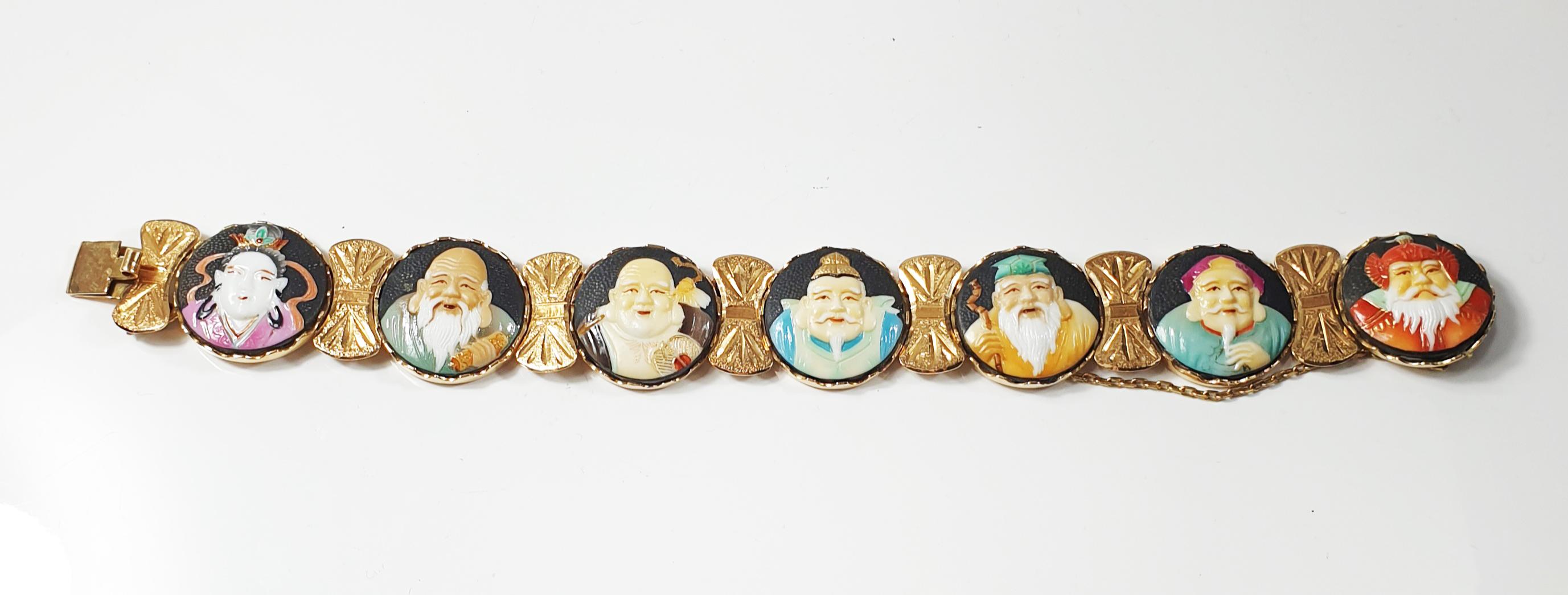 Antique Japanese  Toshikane 7 lucky Gods 18k gold, porcelain bracelet  circa 1940's 
Seven Lucky Gods bracelet of porcelain faces set in 18k solid gold
The detail on each Japanese deity is just incredible
The seven gods of fortune, or seven