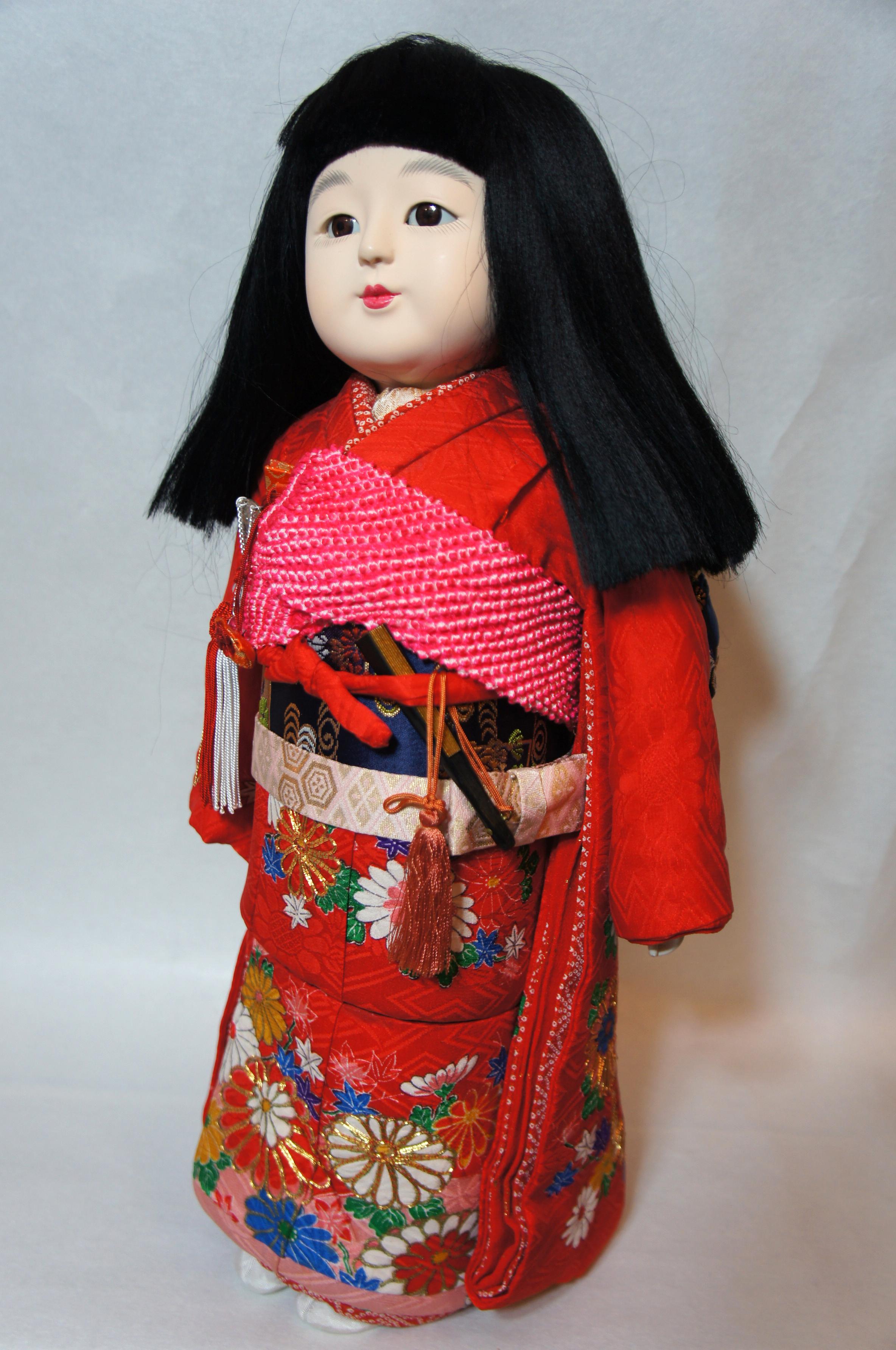 Beautiful Japanese traditional kimekomi ichimatsu girl doll.
The doll wear the beautiful kimono, haori and obi that were made of silk with decorative pattern.
This doll's body was made of wood, and face was made of plaster by hand. The face was