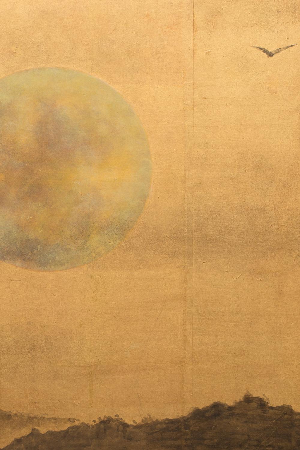 Japanese Two Panel Screen: Rising Moon Over Minimal Landscape. Showa period (1926 - 1989) painting with a silver moon painted on a gold background and a foreground of mountains and tree landscape. Beautiful use of negative space. Serene and