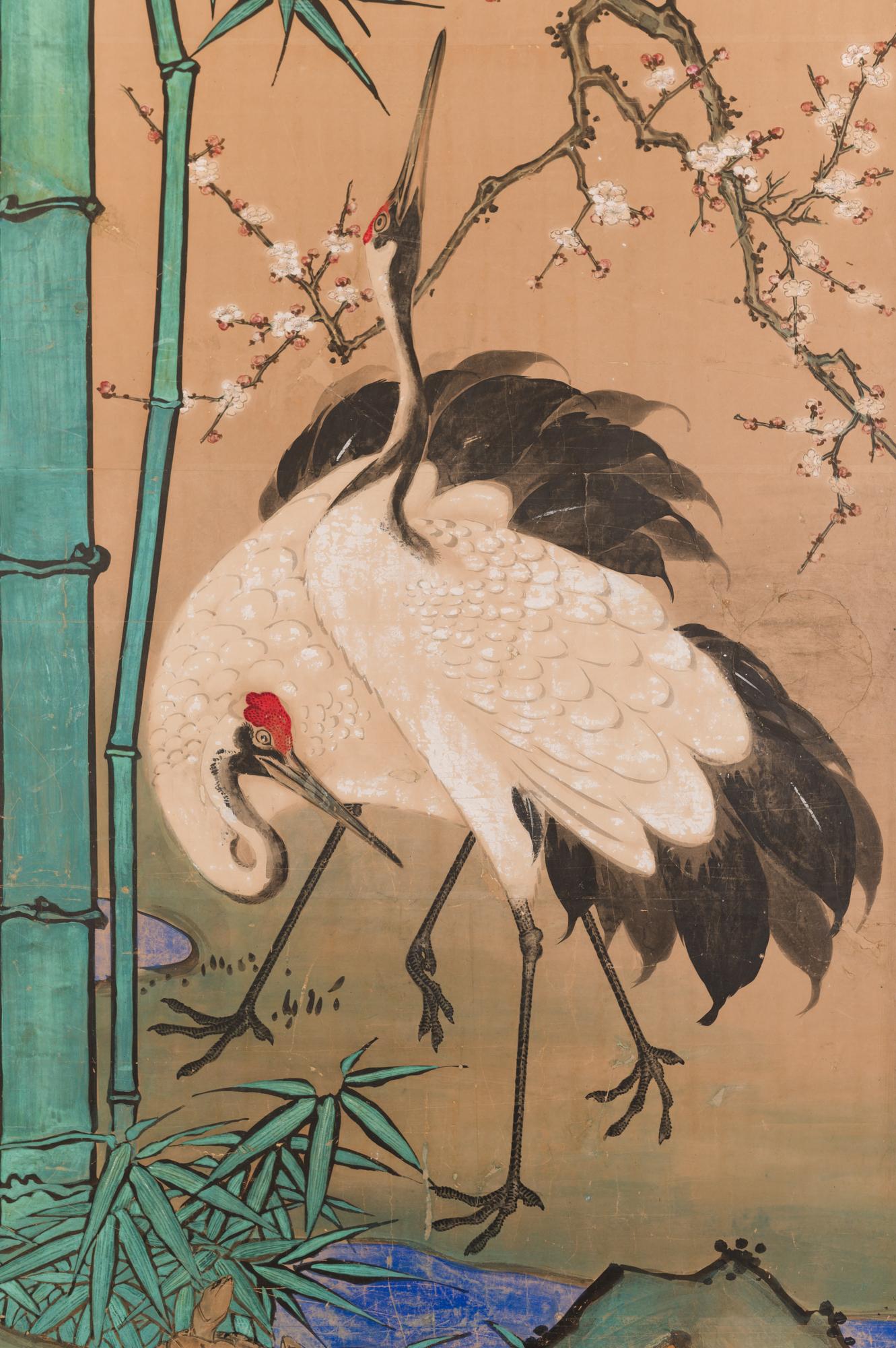 Japanese two panel screen: Amorous Cranes and Turtles. In Japan, cranes symbolize fidelity as they mate for life and turtles symbolize longevity. Additionally, this screen also has the Japanese motif of sho-chiku-bai, or the three friends of winter