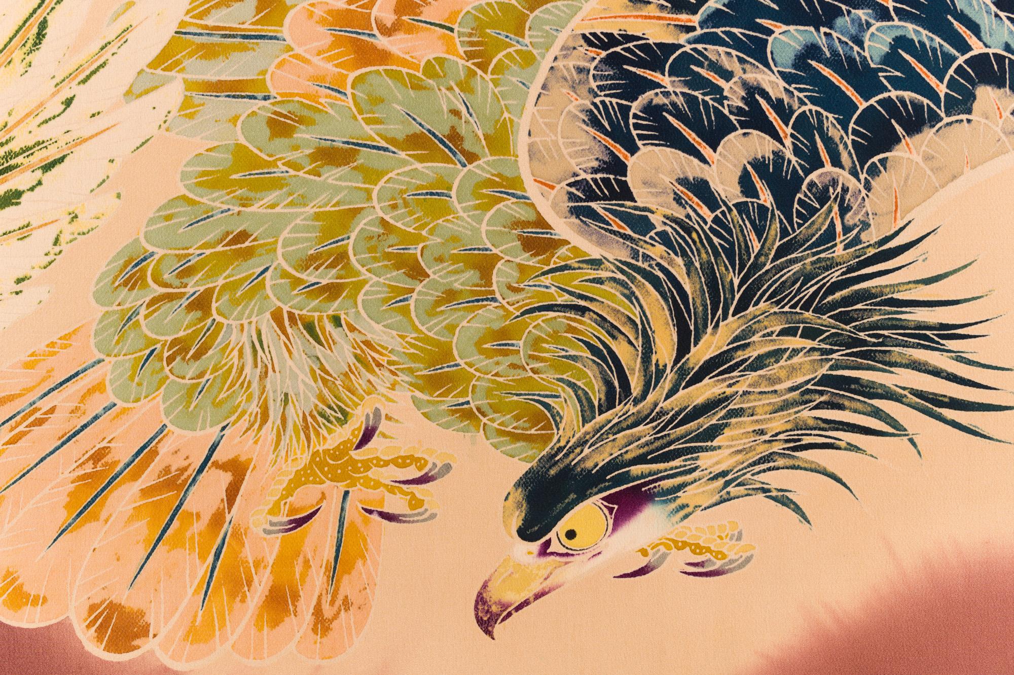 Japanese two panel screen: Falcons in Flight. Showa period (1926-1989) vibrant painting on silk of eagles hunting over turbulent water. The painting on this screen was made using a dying process called somemono, a traditional type of resist dying