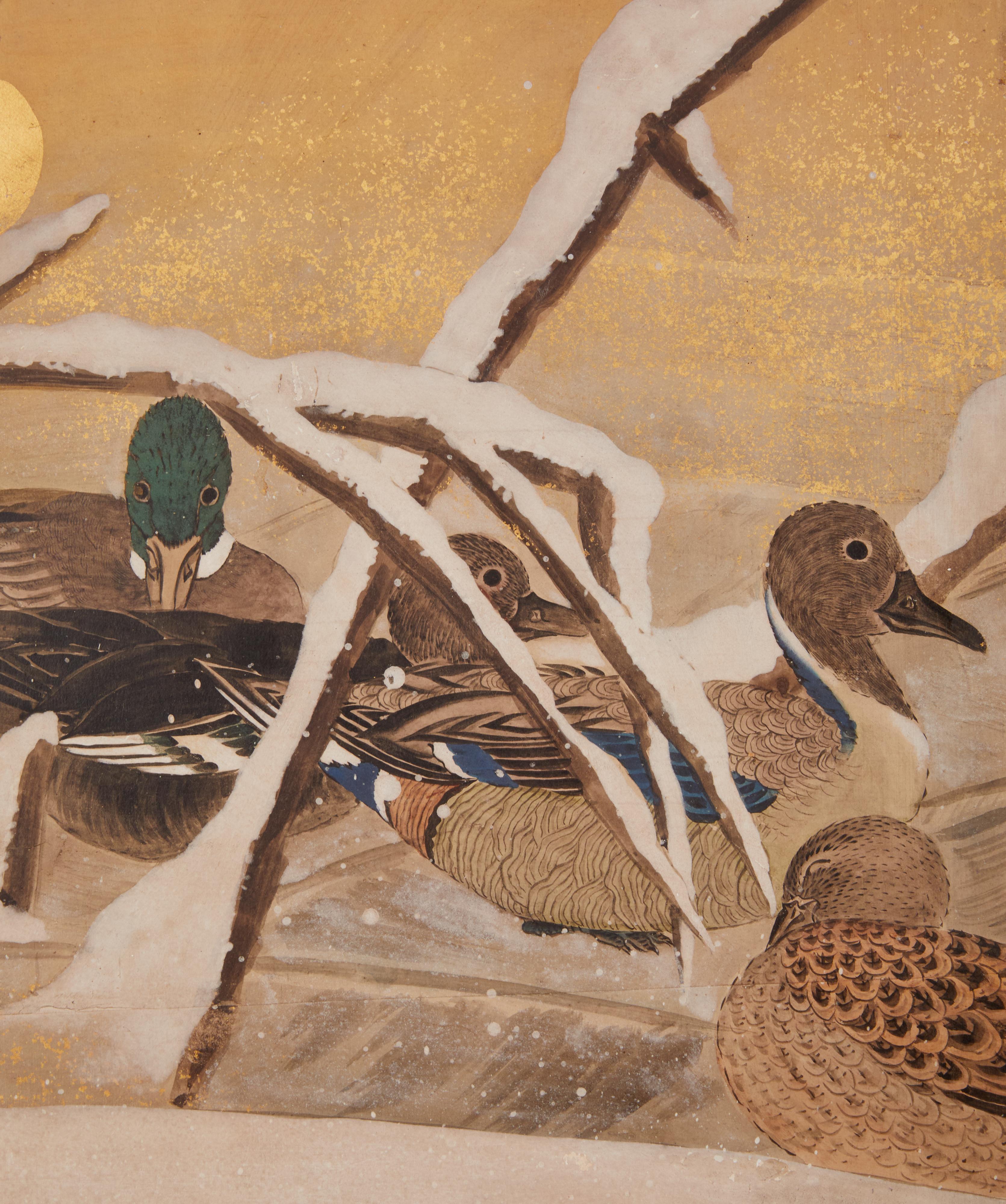 Fine painting of a variety of waterfowl in rich mineral pigments on gold leaf with a silk brocade border.