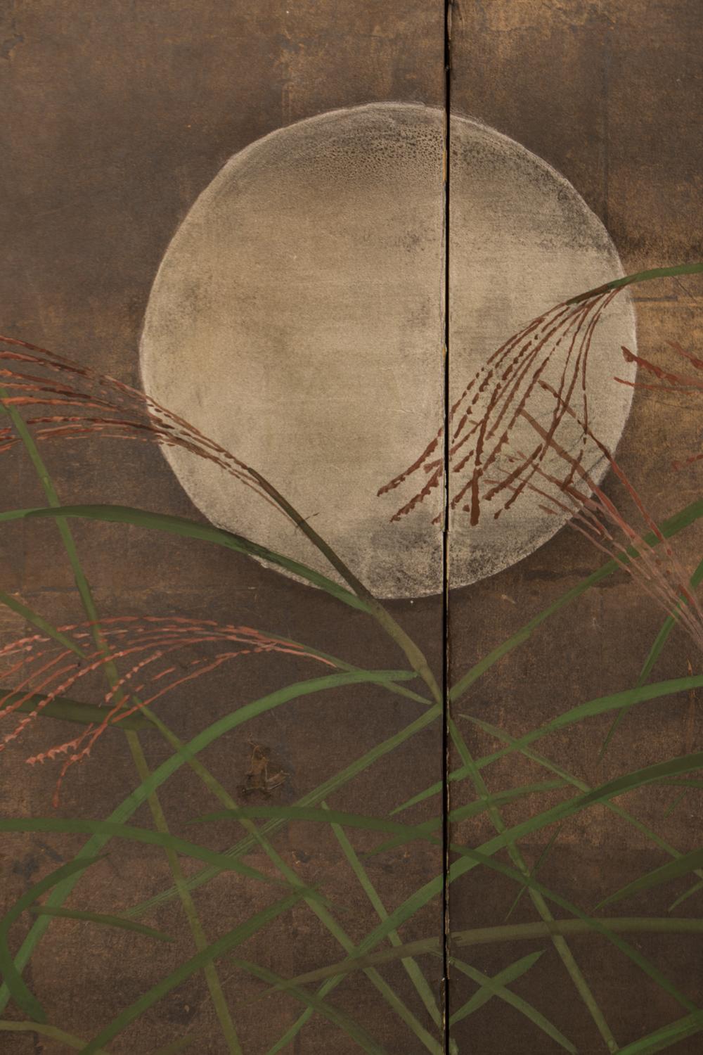 The oxidized silver gives the effect of a night sky in the background. Moonlit wild grasses bend in the wind under gentle night clouds. Could possibly be a painting of the Plains of Musashino, a popular theme in Japanese art.