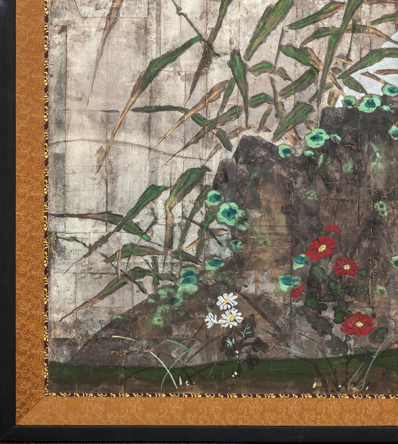 Japanese two panel screen: Moon rising through bamboo on silver leaf, Meiji period painting (1868 - 1912) of the moon rising on the horizon with a garden stone in the foreground. Lichen and small flowers growing on and around the stone. Mineral