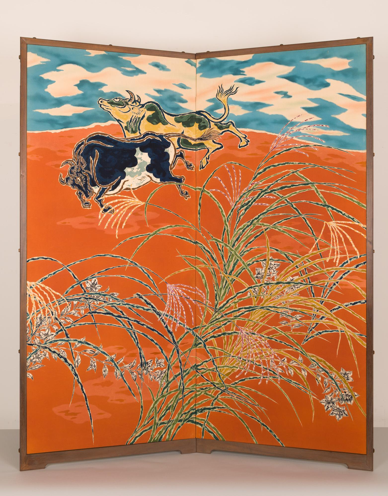 Showa period (1926 - 1989) vibrant painting on silk of playful steers under a cloudy sky amidst pasture grasses. The painting on this screen was made using a dying process called somemono, a traditional type of resist dying similar to batik. The