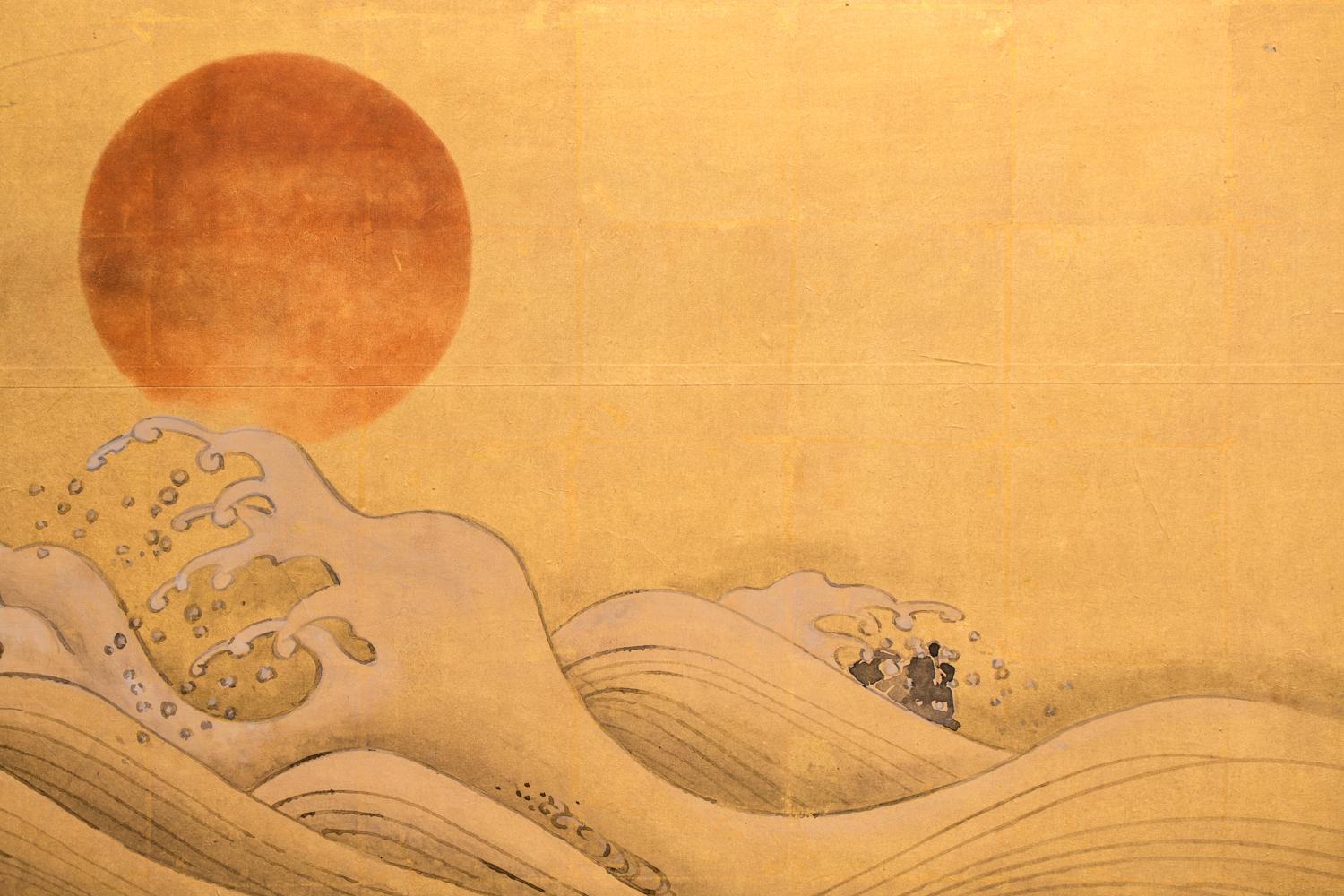 Meiji period (1868 - 1912) painting of Hokusai-style waves with a setting sun.  Painted with mineral pigments on gold leaf with a silk brocade border.