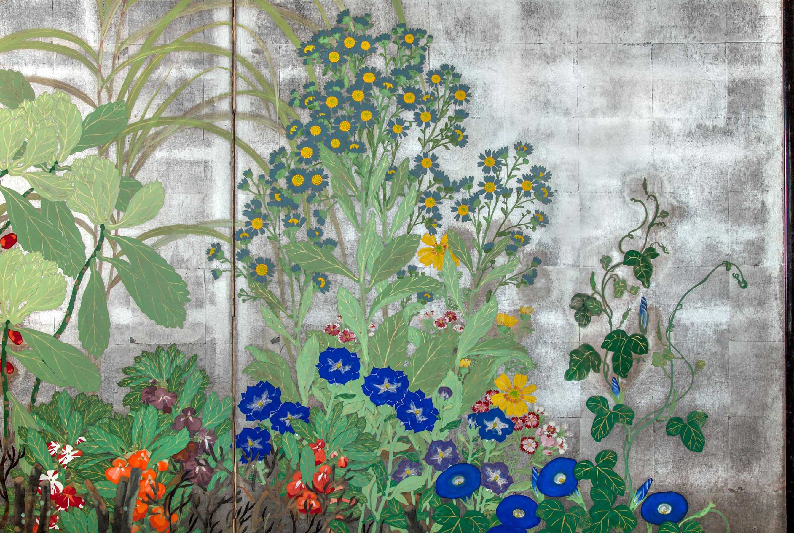 Japanese two panel screen: Summer flowers on silver. Meiji period painting (1868 - 1912) of Summer flowers including morning glories and daisies against a garden fence. Signature and seal read: Mukai. Mineral pigments painted on silver leaf. One of