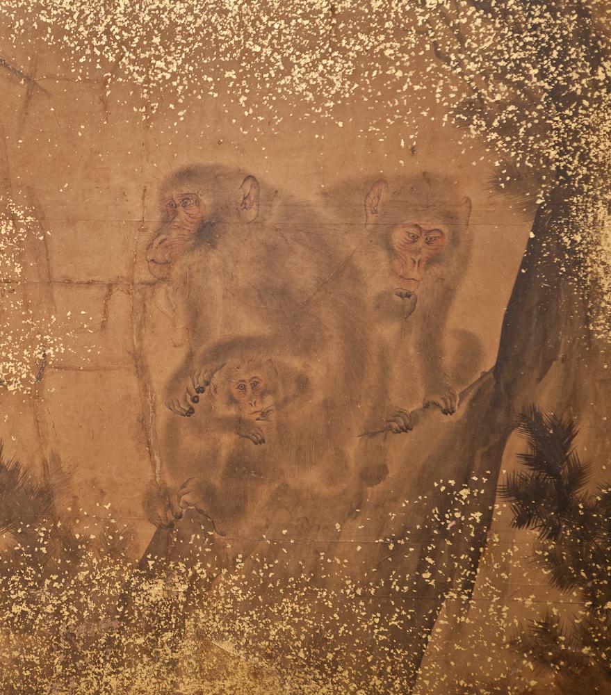 Japanese Two Panel Screen: Troop of Monkeys in a Tree.  Edo period (Mid 19th century) ink painting (sumi-e) of interactions between a group of Japanese macaques.  Ink and minimal pigments on mulberry paper with gold dust and a double border in gold
