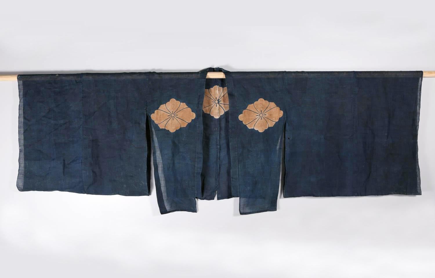 A two-piece Japanese festival costume based on Kyogen theater performance circa late 19th century (Meiji Period). The matching assemble consists of an oversize jacket (Suo) and a pair of trousers (hakama). Made from a fine and gauze-like indigo dyed