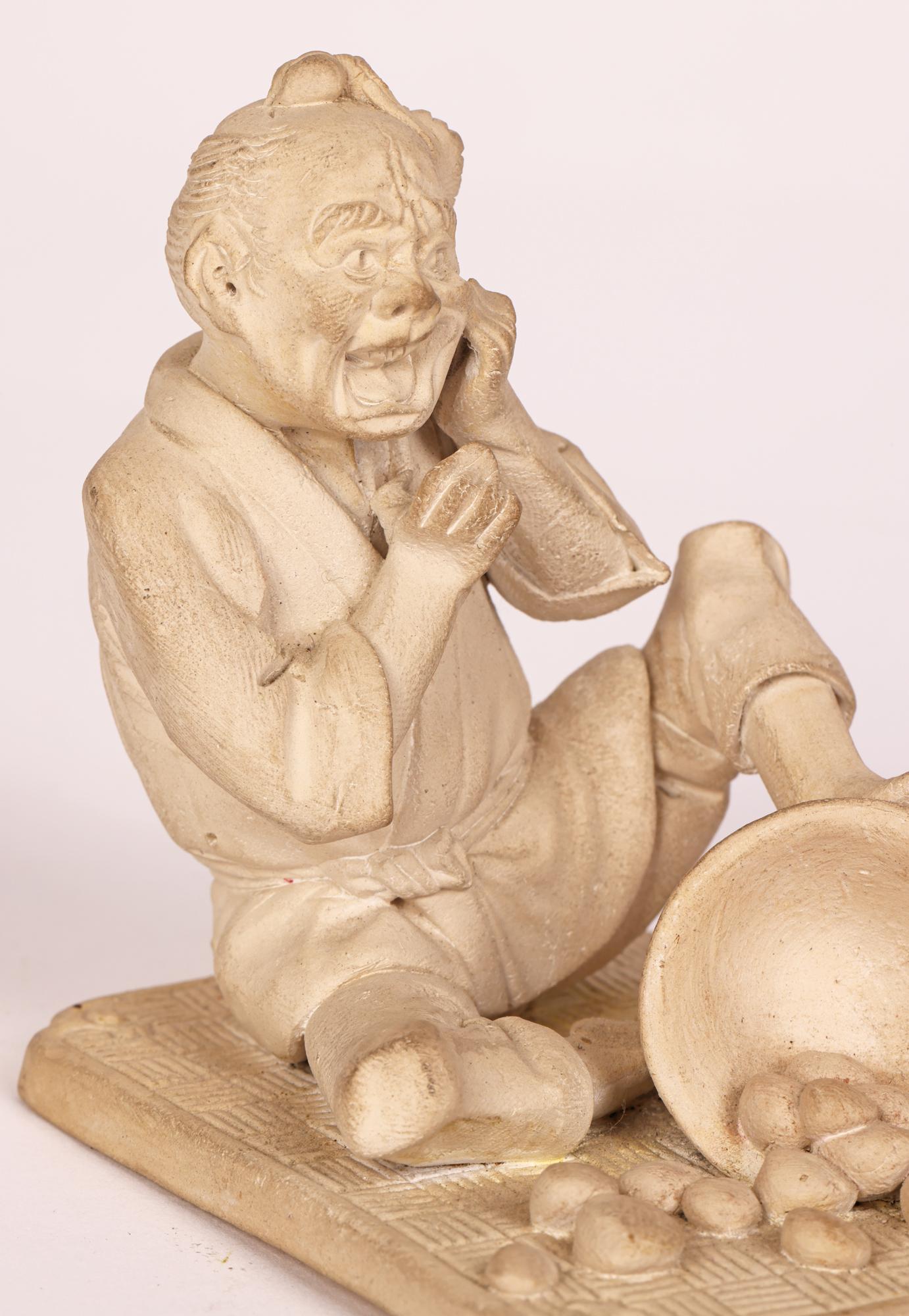 Japanese Unglazed Pottery Figure of a Pedlar Being Stung by a Wasp For Sale 11