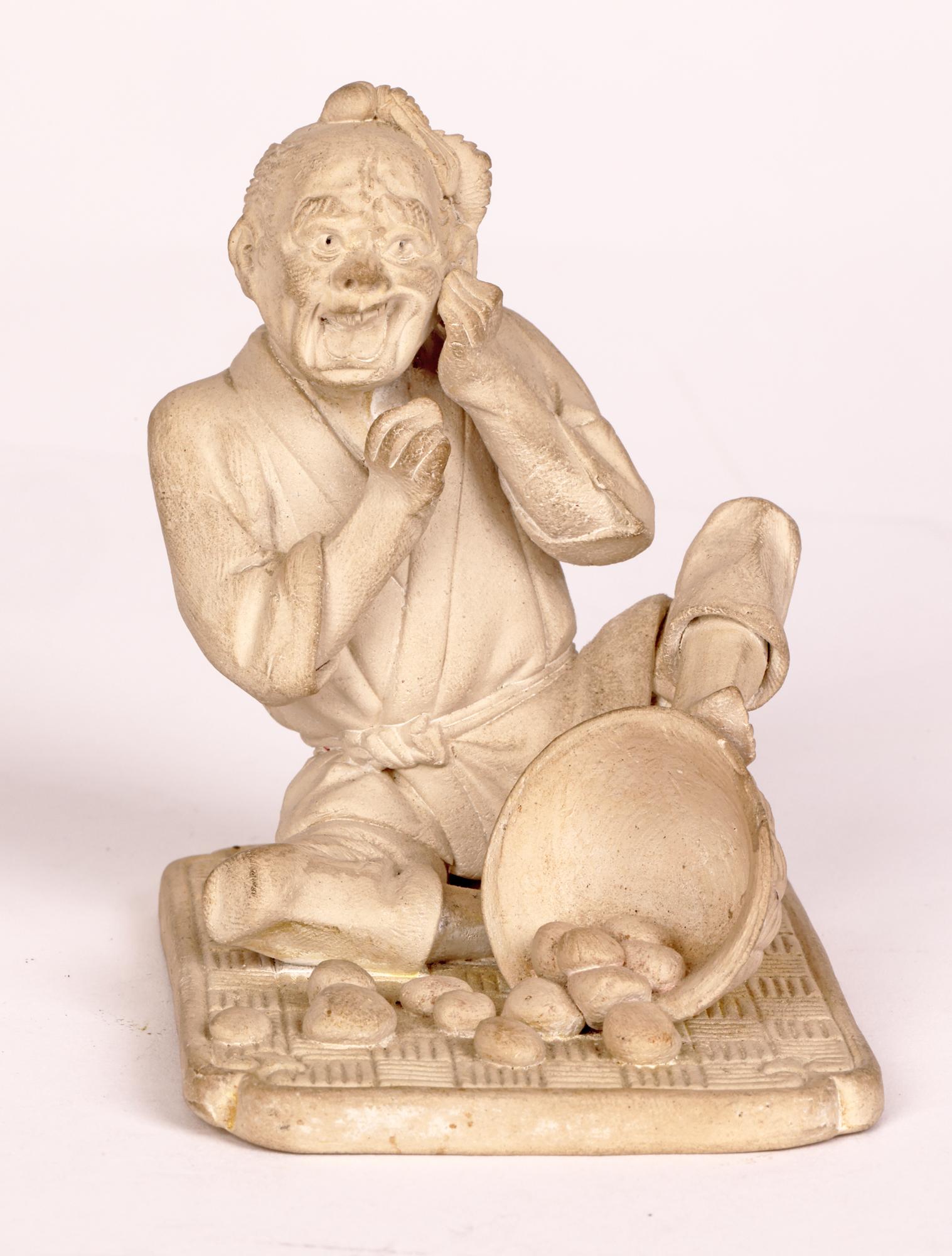 Hand-Crafted Japanese Unglazed Pottery Figure of a Pedlar Being Stung by a Wasp For Sale