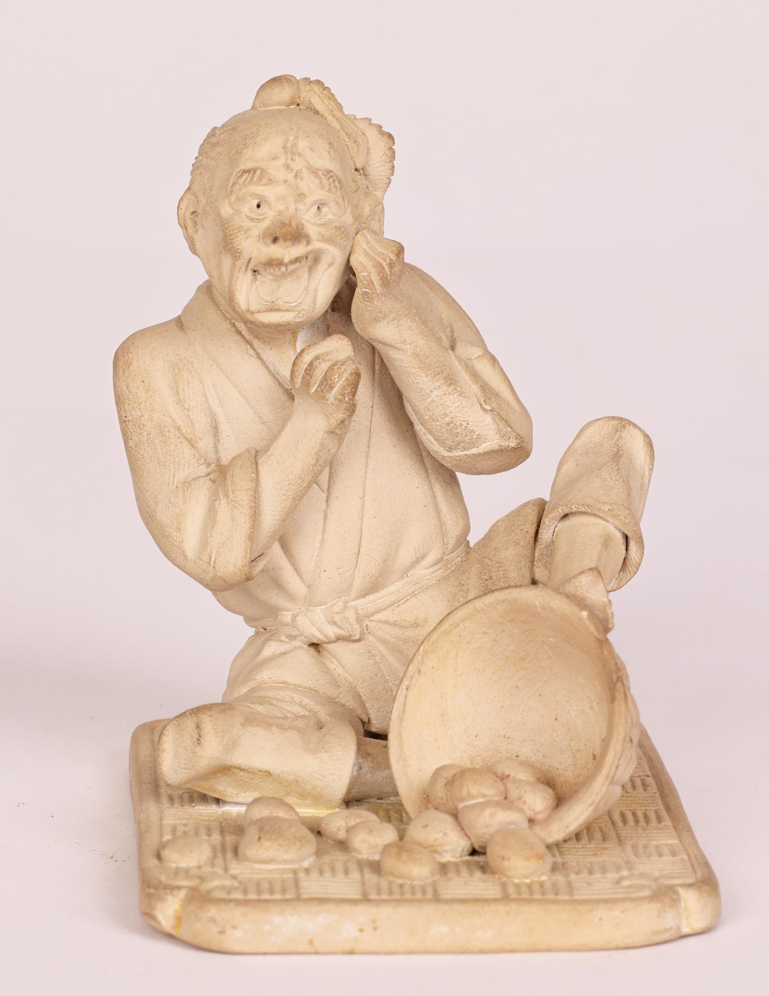 Japanese Unglazed Pottery Figure of a Pedlar Being Stung by a Wasp For Sale 3