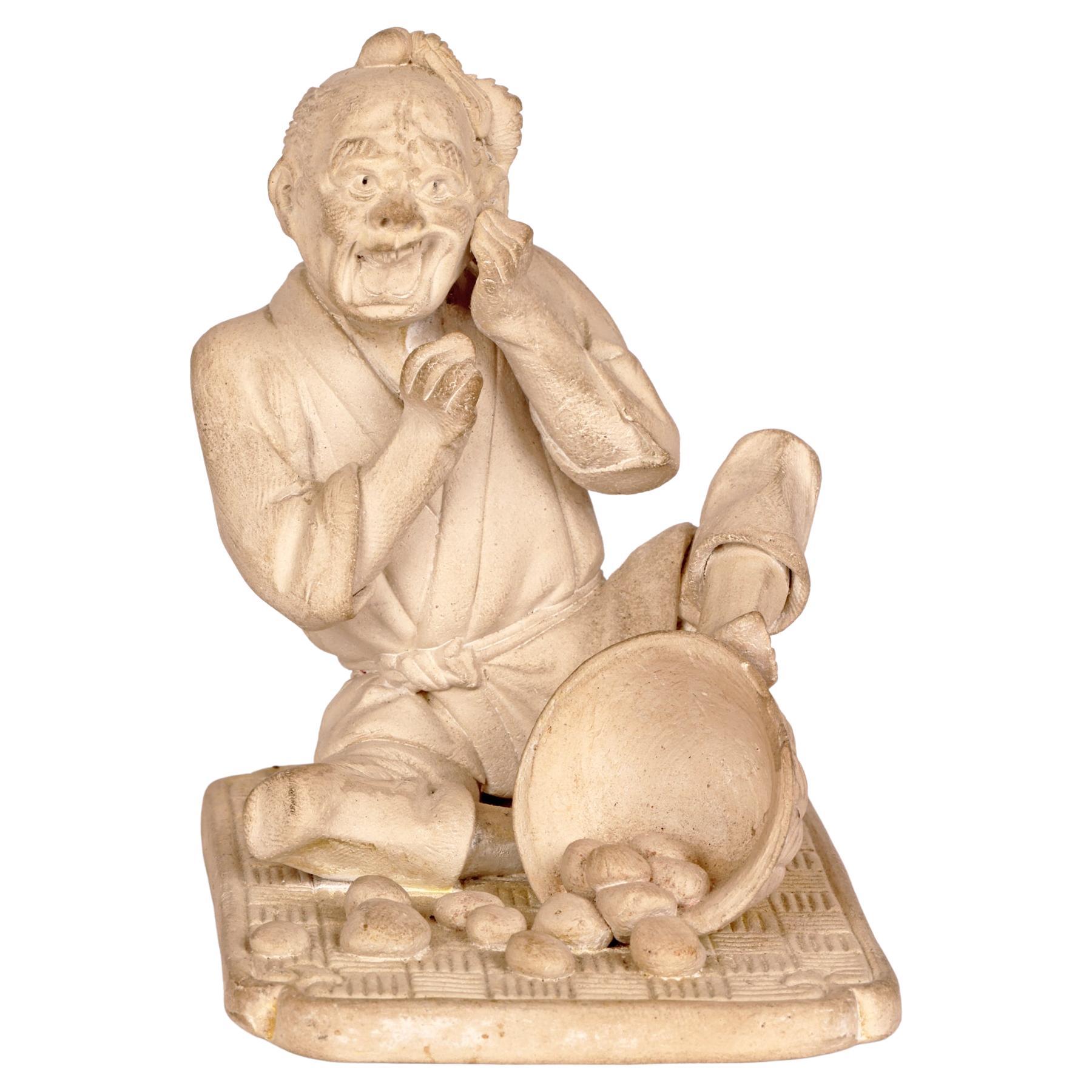 Japanese Unglazed Pottery Figure of a Pedlar Being Stung by a Wasp For Sale