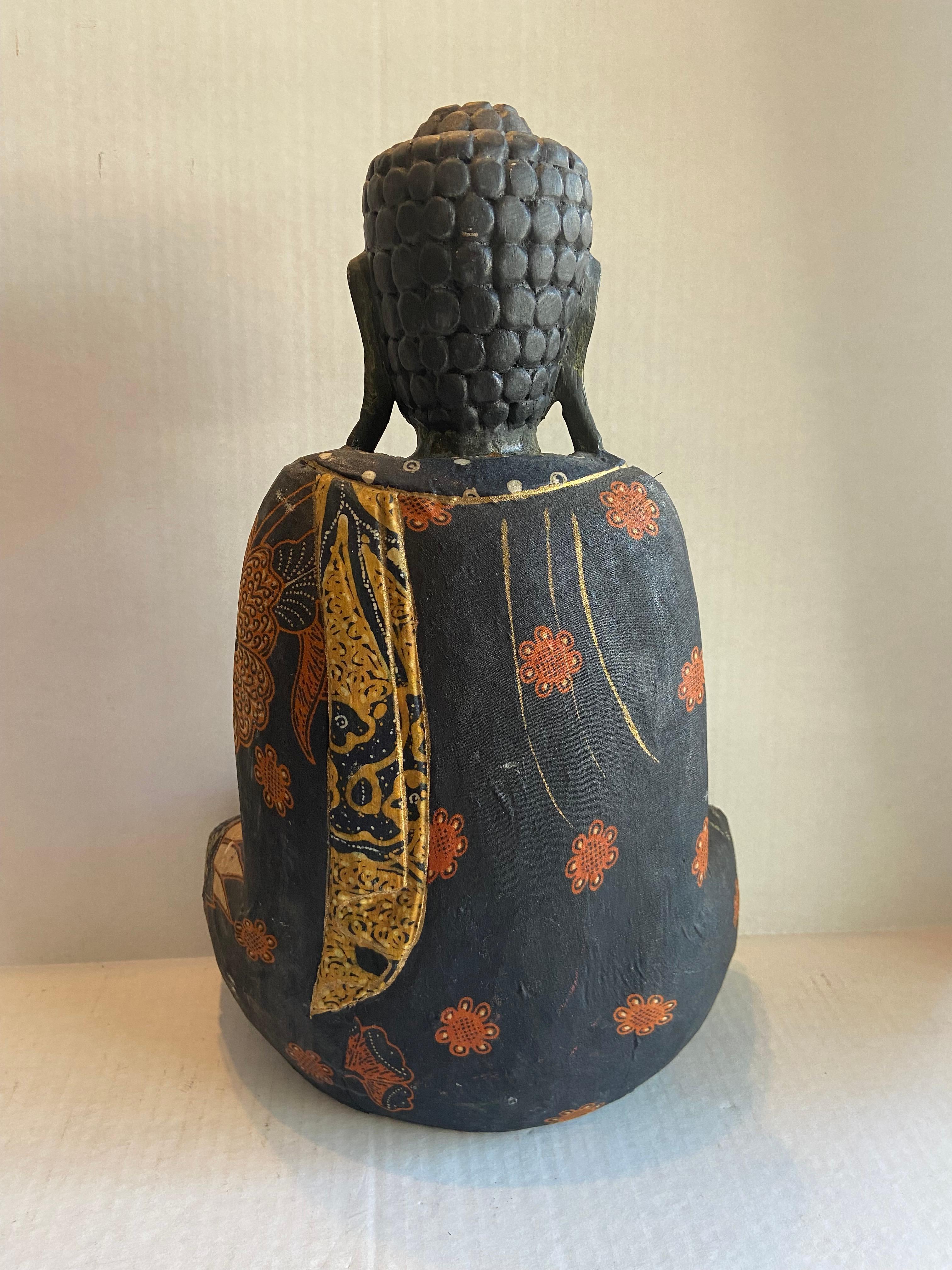 Japanese Unique antique black meditation Buddha. Decoupaged with antique Japanese textiles Depicting red Chrysanthemums (the symbol of love and deep passion) and cascading Gold Scarf down the back. Hand carved and painted gold leafed details. Snail