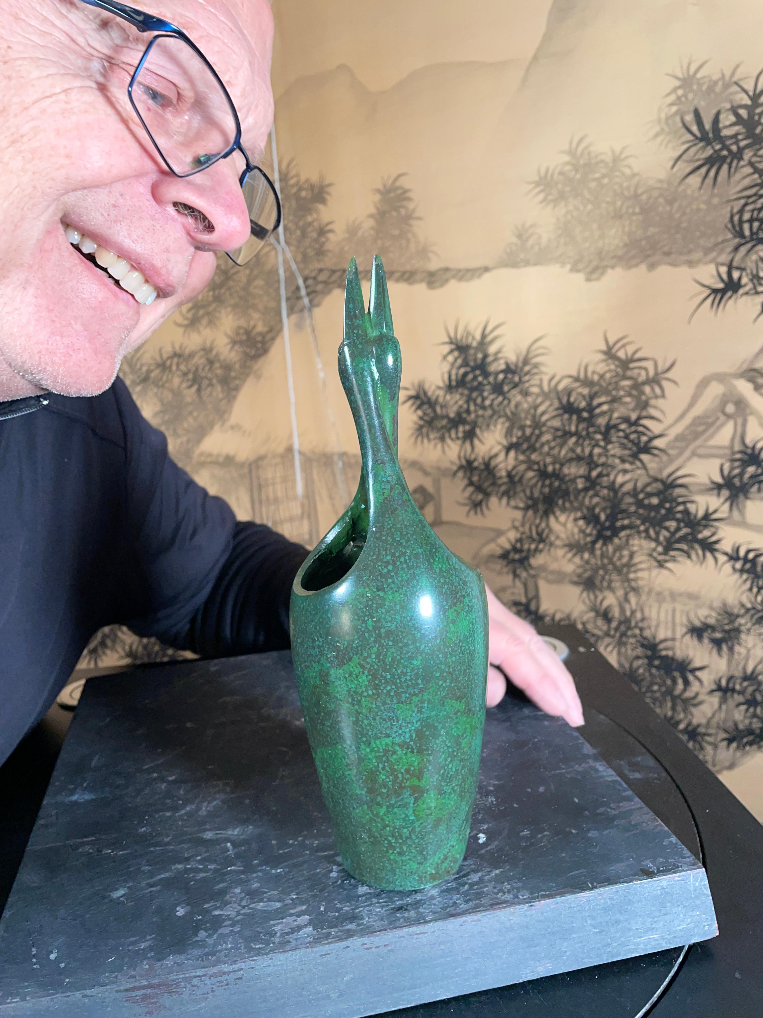 From Our Recent Japanese Acquisitions

From Japan comes this beautiful hand cast bronze mating or double cranes bud vase with an attractive green finish. It comes complete with its original signed collector storage box tomobako. This vase is in