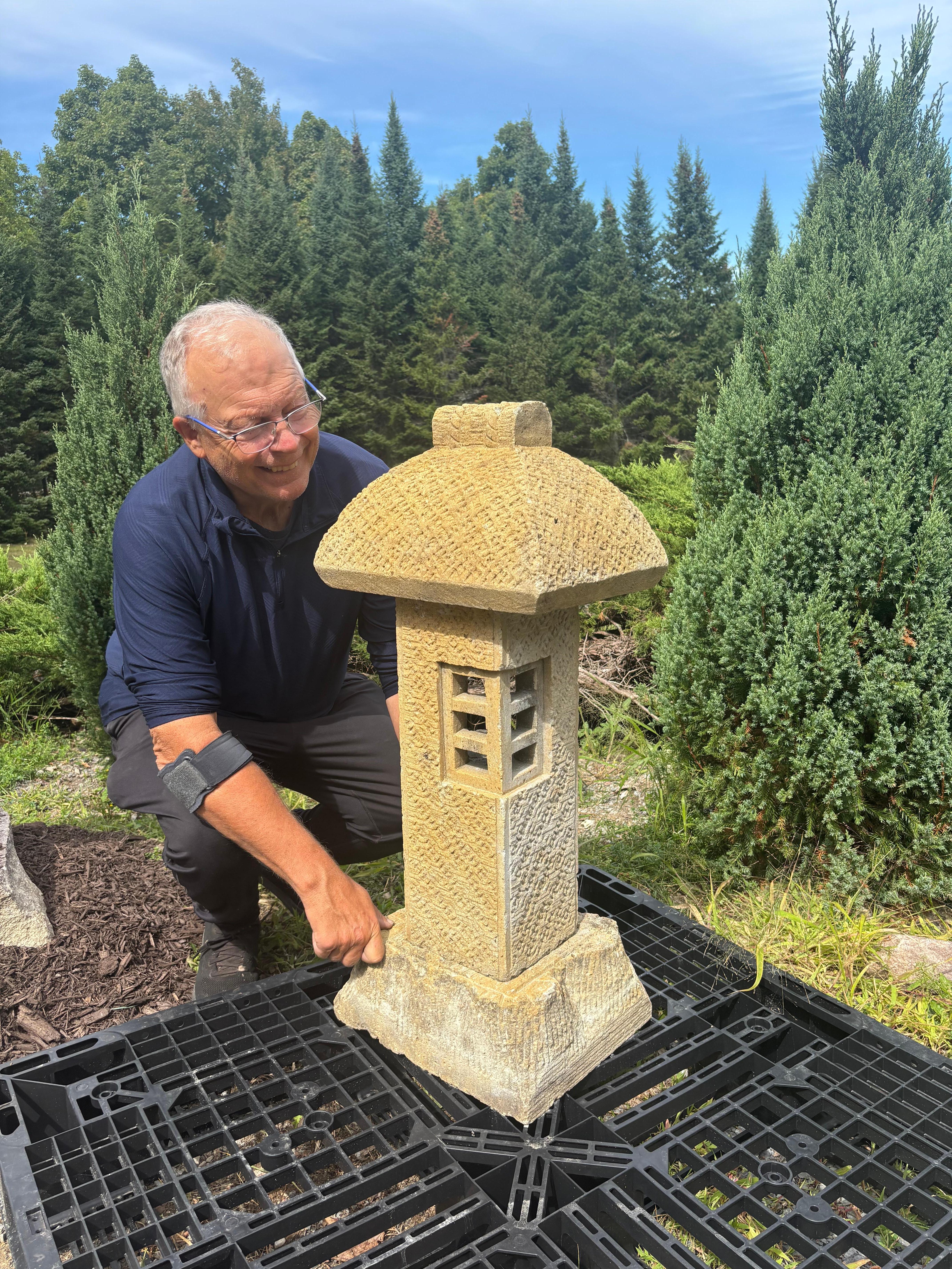Japan unusual Well Carved Stone Driveway and/or Walkway path lantern.

Miyoshi designed this lantern with the intention of making the world a brighter place. Now the Miyoshi lantern is not just used at only crossroads. It is famous for its role in