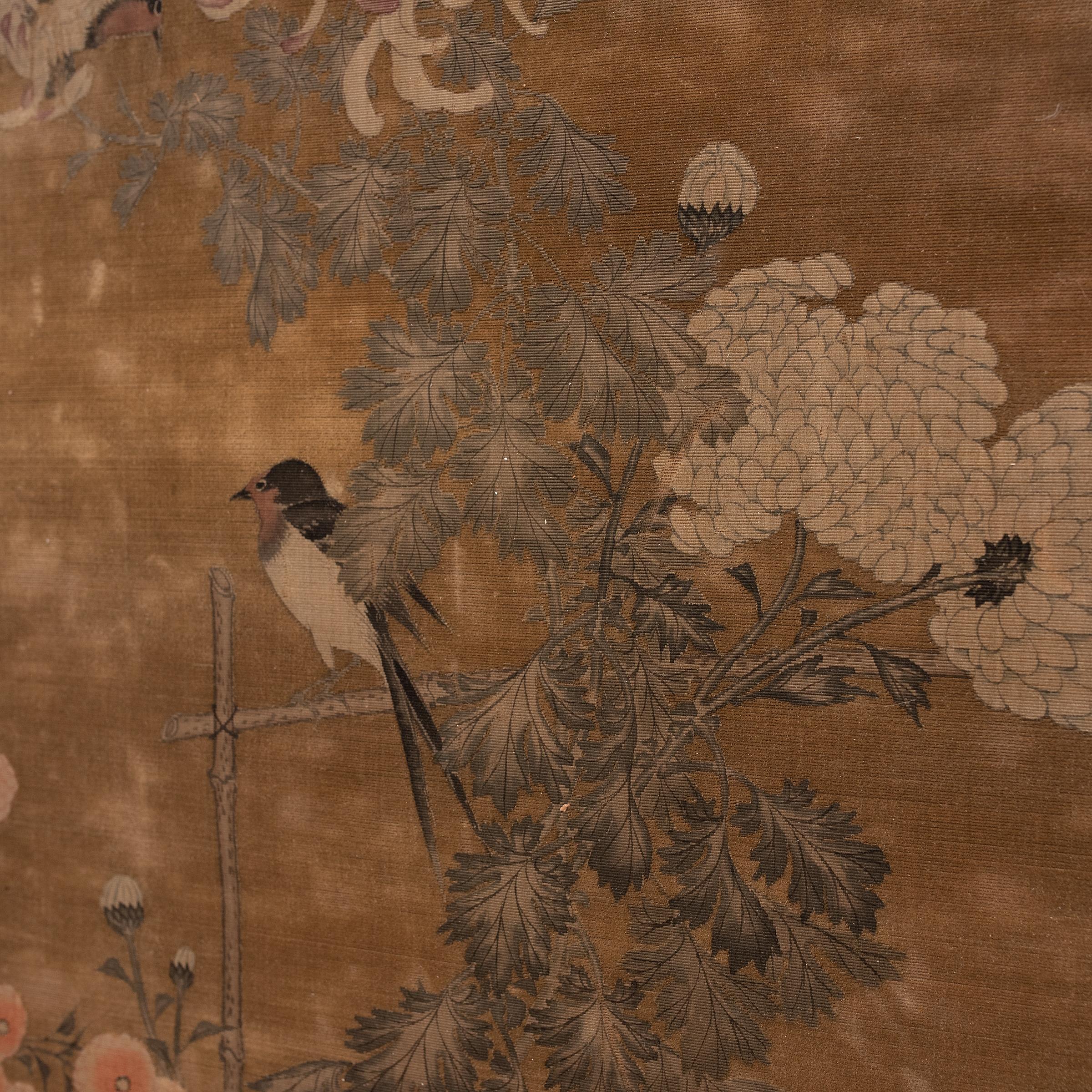 This beautiful gold-toned painting on silk and velvet is originally from a 19th-century Japanese handscroll. The painting depicts a quiet scene of two black and white magpies flitting amidst chrysanthemum, beautifully drawn with delicate linework