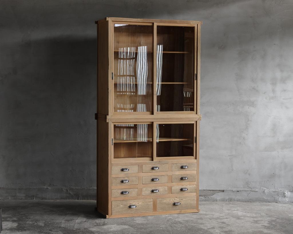 This vintage cupboard was crafted in the Early Showa Period (1926-)

This dish cupboard, crafted in the early Showa era, combines timeless design with practical functionality. Made primarily from warm and natural cedar wood, it features drawer