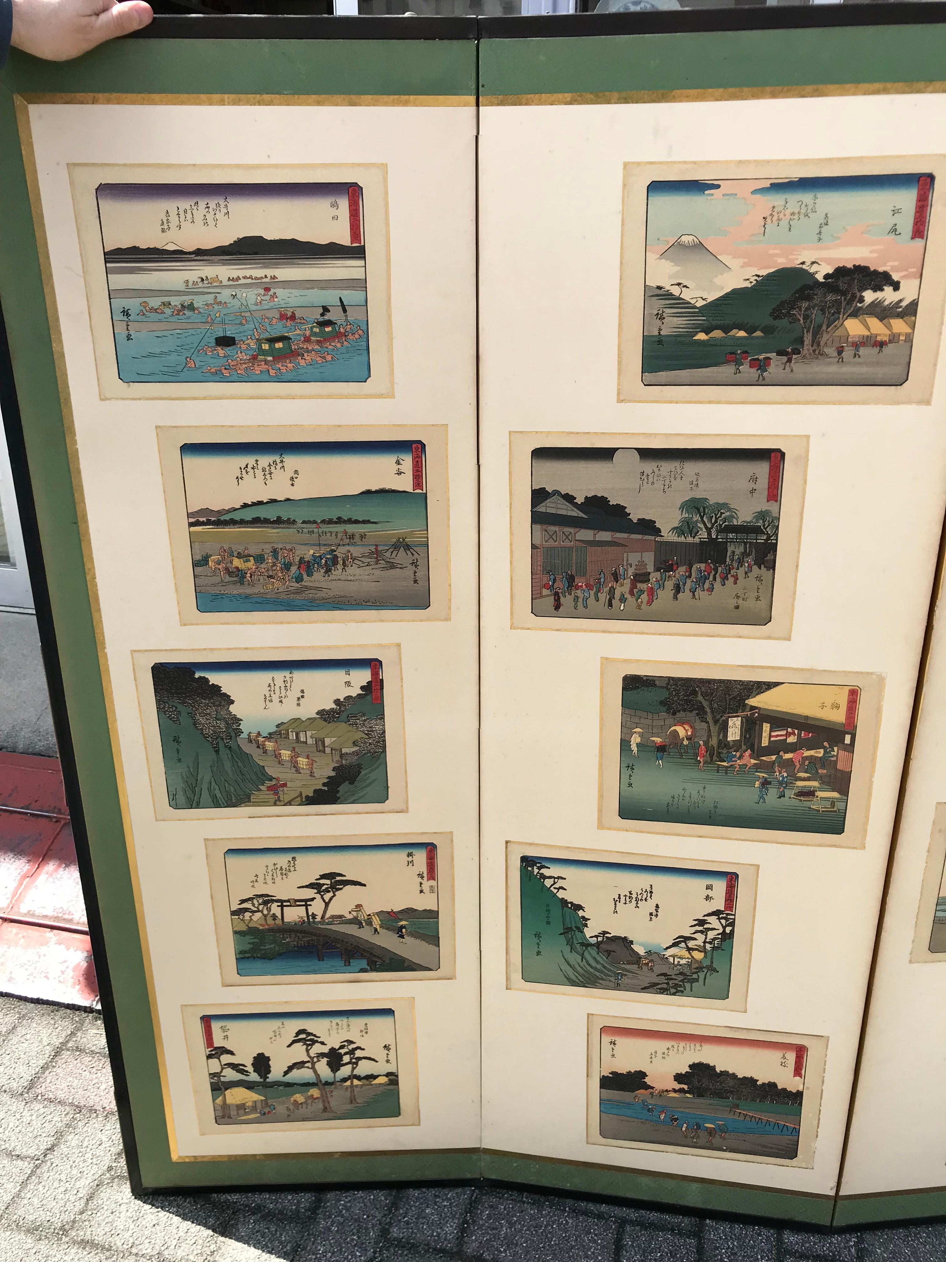 This unusual Japanese six-panel Byobu screen with twenty eight (28) authentic and old Hiroshige Tokaido Road series ukiyo-e prints applied on paper, in a symmetric and balanced manner and with a cream colored ground. 

It dates in the first half of