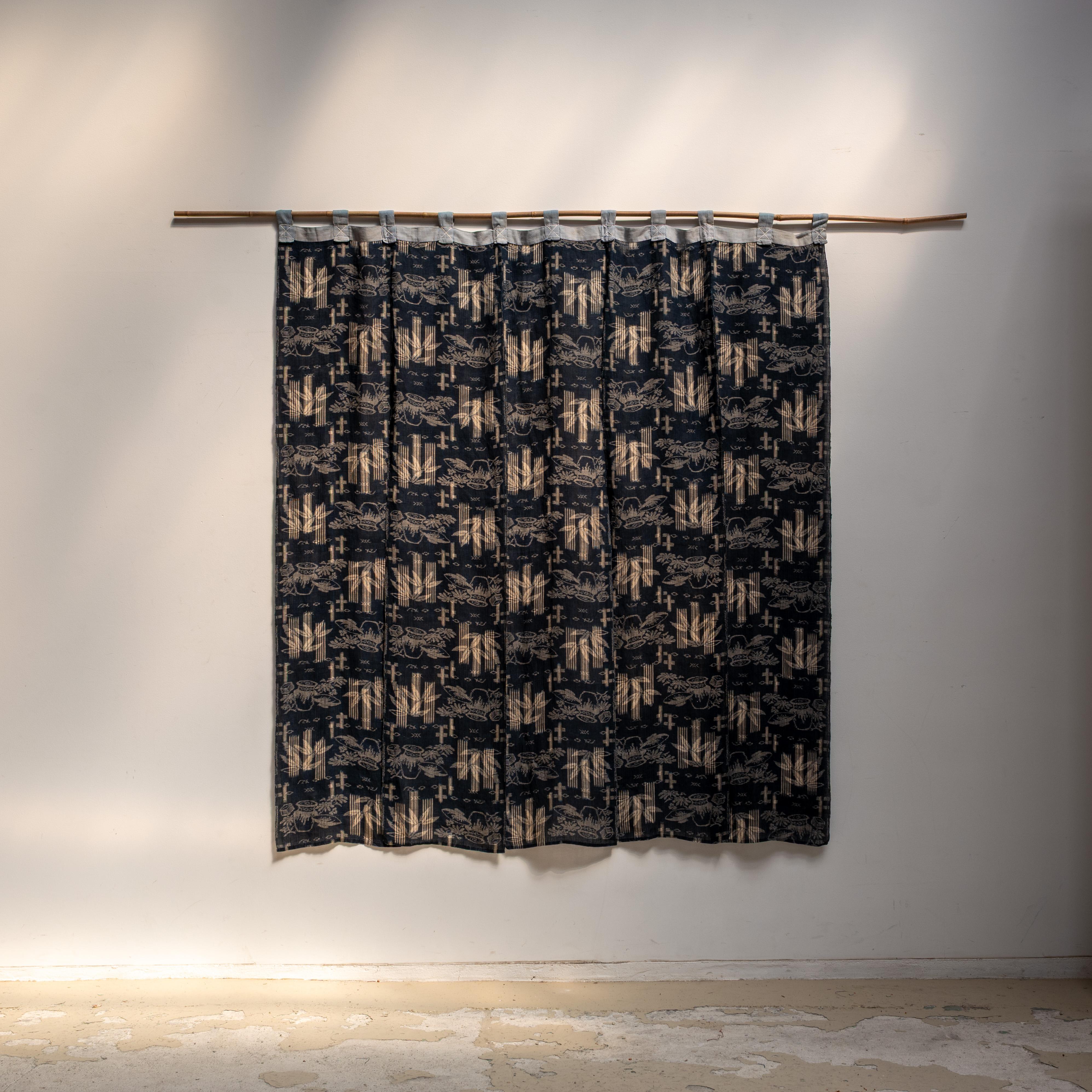 The unique and beautiful fabric piece, that's called noren - traditional Japanese fabric divider that was made during the Meiji era. This traditional Japanese curtains used to divide spaces, ensure privacy, and serve as decorative elements in shops