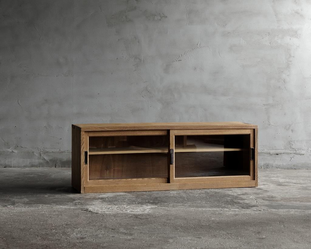 This vintage low cabinet was crafted in the Early Showa Period '1926-'.

Crafted from vintage Japanese ash wood, this low board showcases the unique charm and character developed over time. The natural texture of the wood enhances its simple yet
