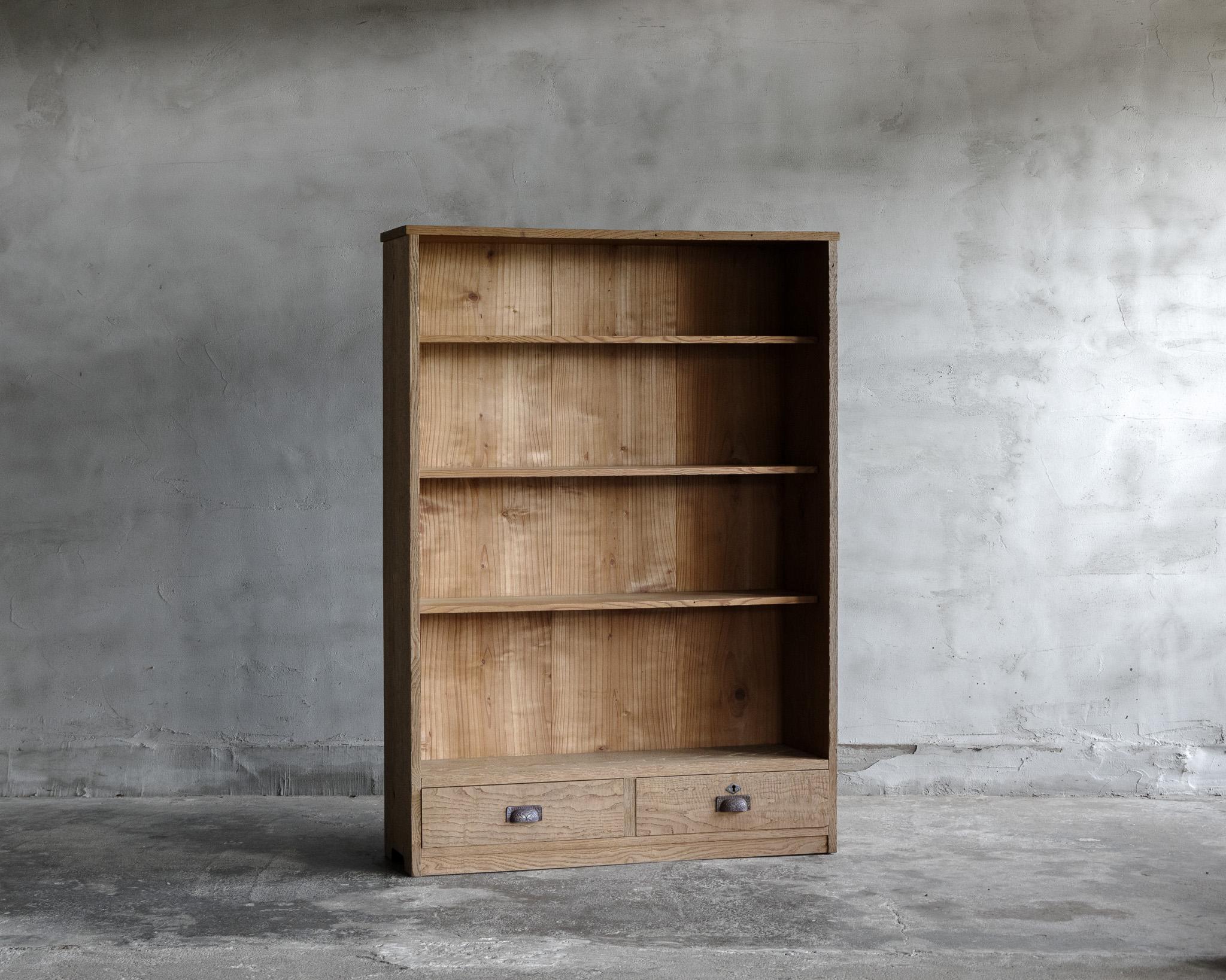 This vintage open display shelf was crafted in the Early Showa Period (1926-)

This display shelf, crafted in the early Showa period, is made from rich, deep-toned chestnut wood. The aging process has enhanced its character, adding a unique and