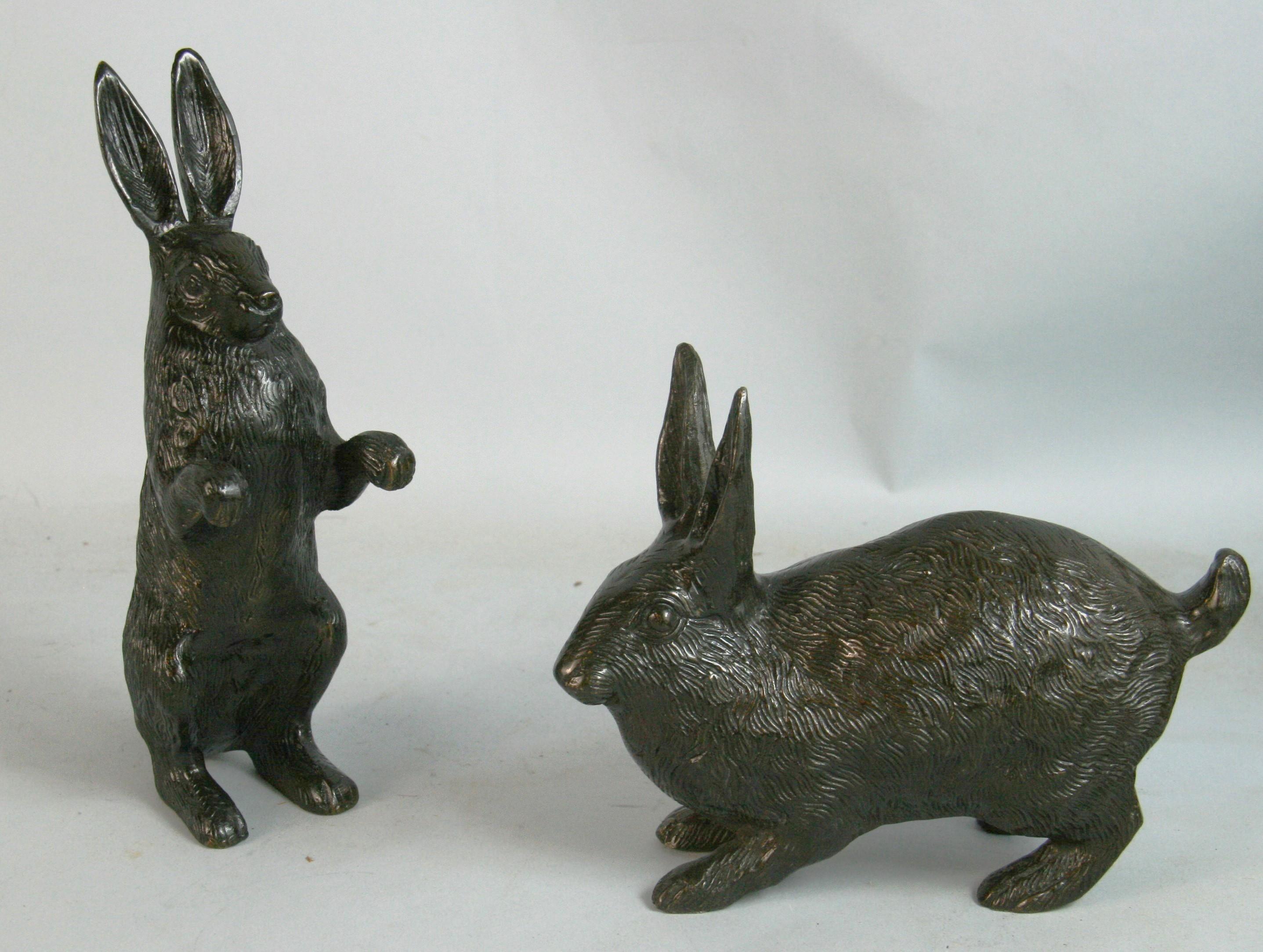 1577 Pair of hand cast bronze garden rabbits one stand and the other crouching
Its fine detailed 
